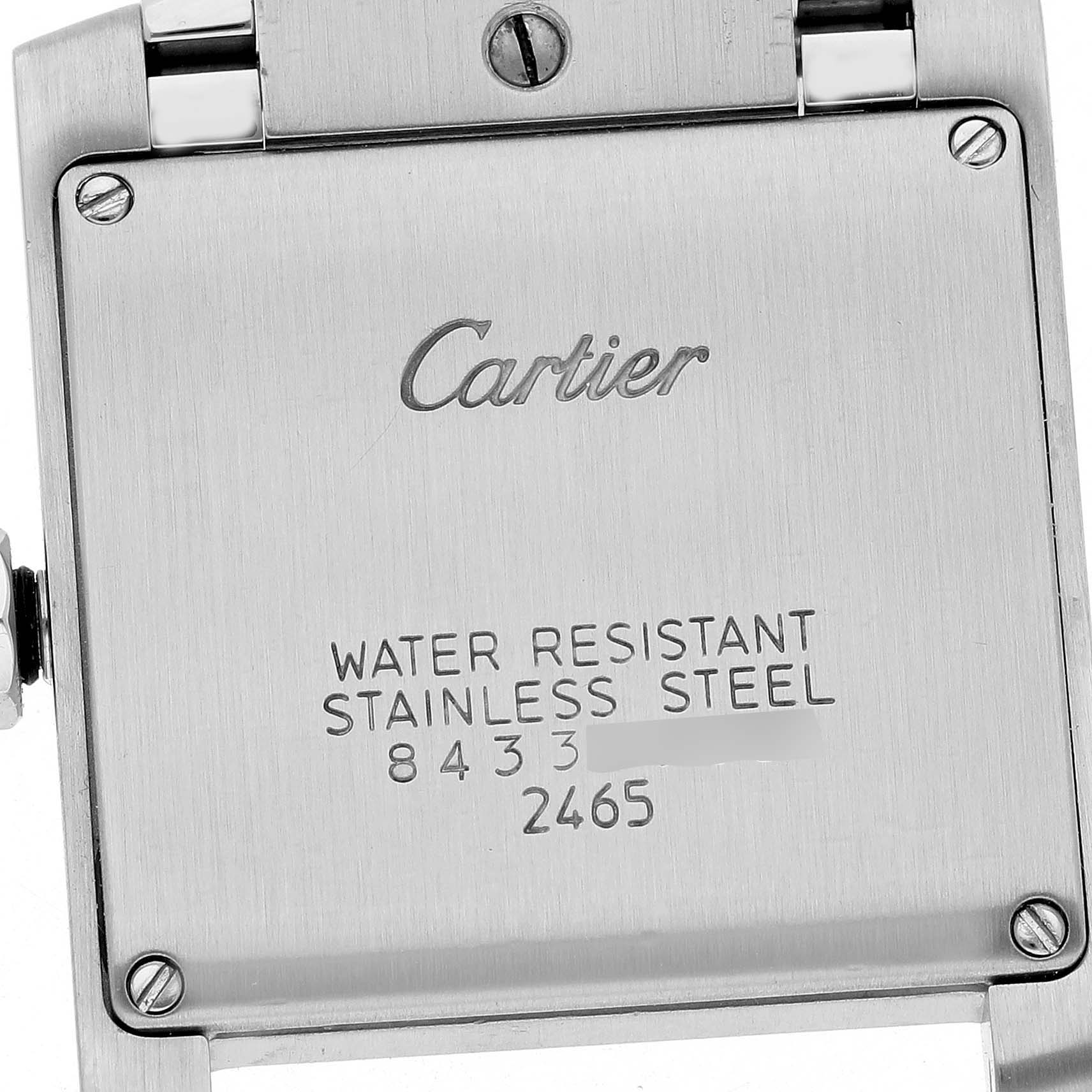 The image shows the back case of the Cartier Tank Française watch, highlighting the brand engraving and water resistance details.