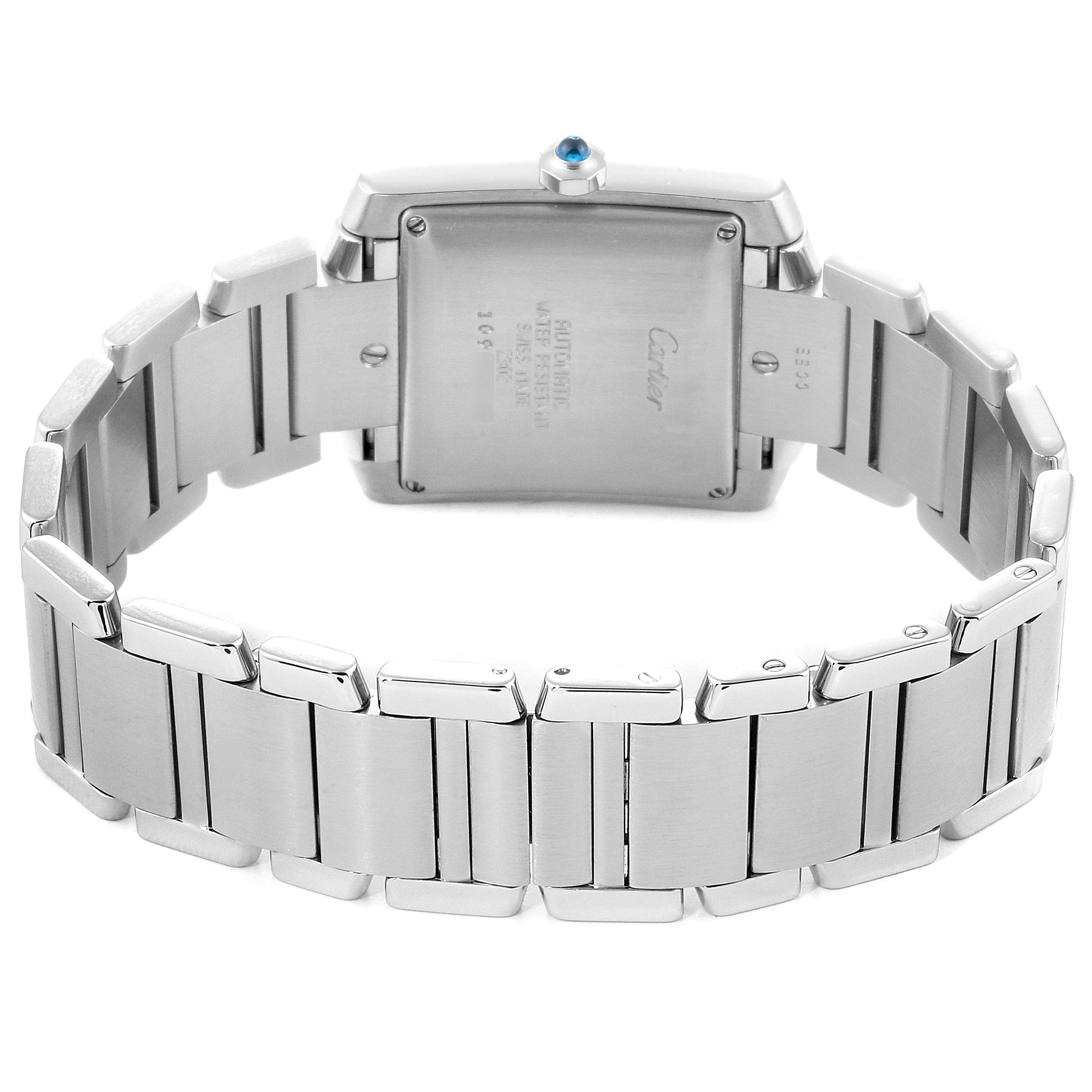 The image shows the back view of a Cartier Tank Française watch, highlighting the stainless steel case and bracelet.