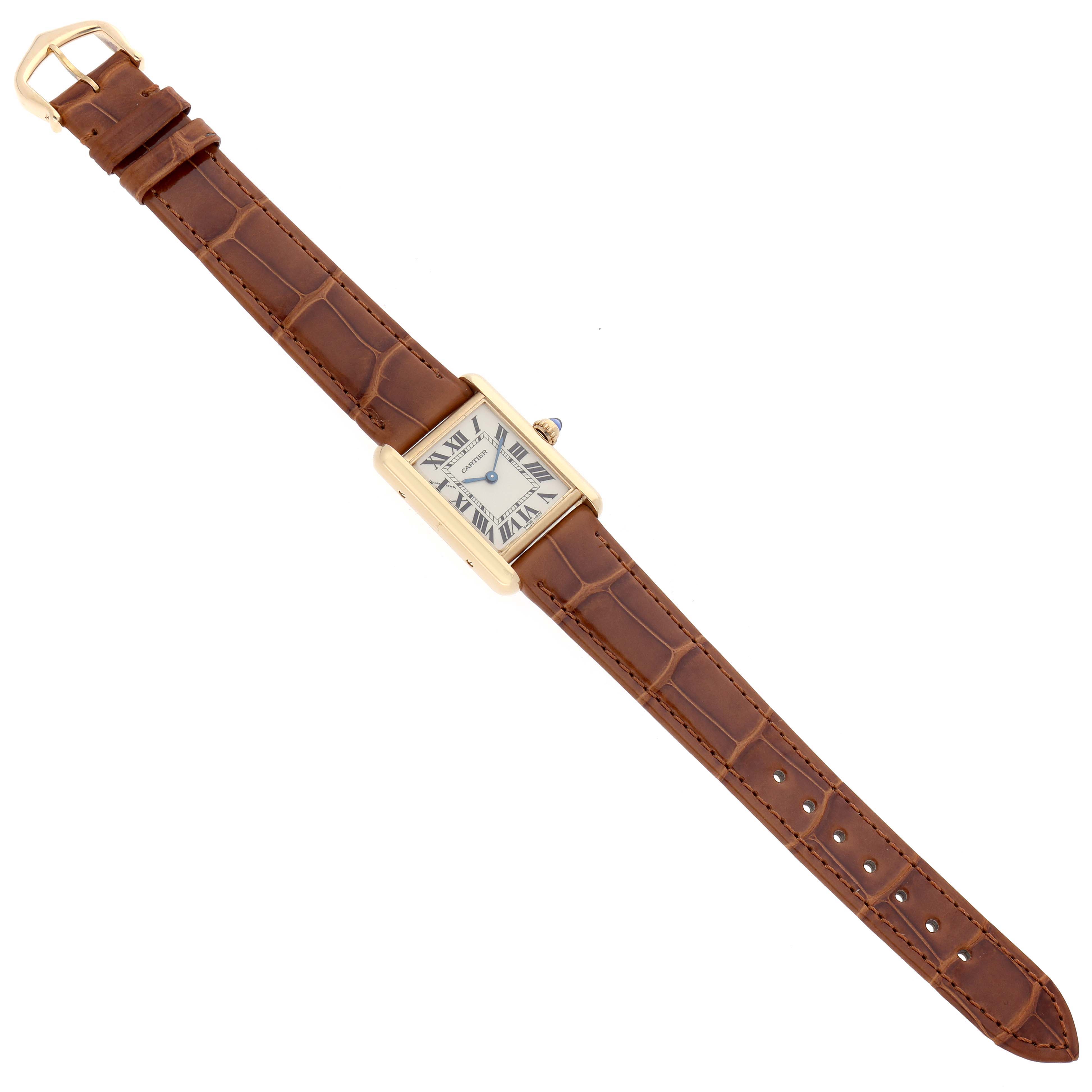 The Cartier Tank Louis W1529856 Women
s Yellow Gold Silver Dial watch is shown from a top-down angle, featuring its rectangular face and brown leather strap.