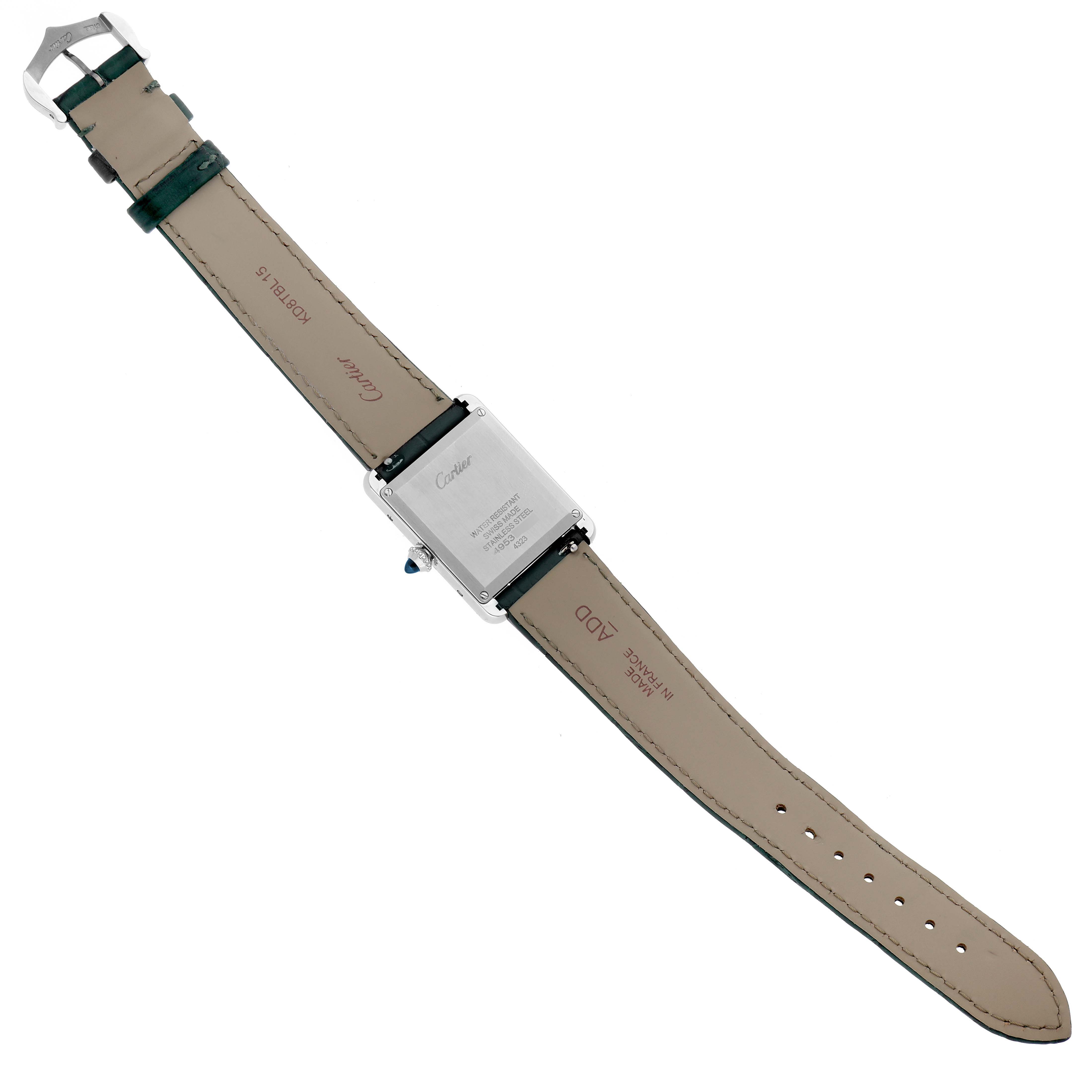 This image shows the underside of the Cartier Tank Must WSTA0056 Women's Stainless Steel Green Dial WSTA0056 Women's Stainless Steel Green Dial watch, highlighting the back of the case and the leather straps.
