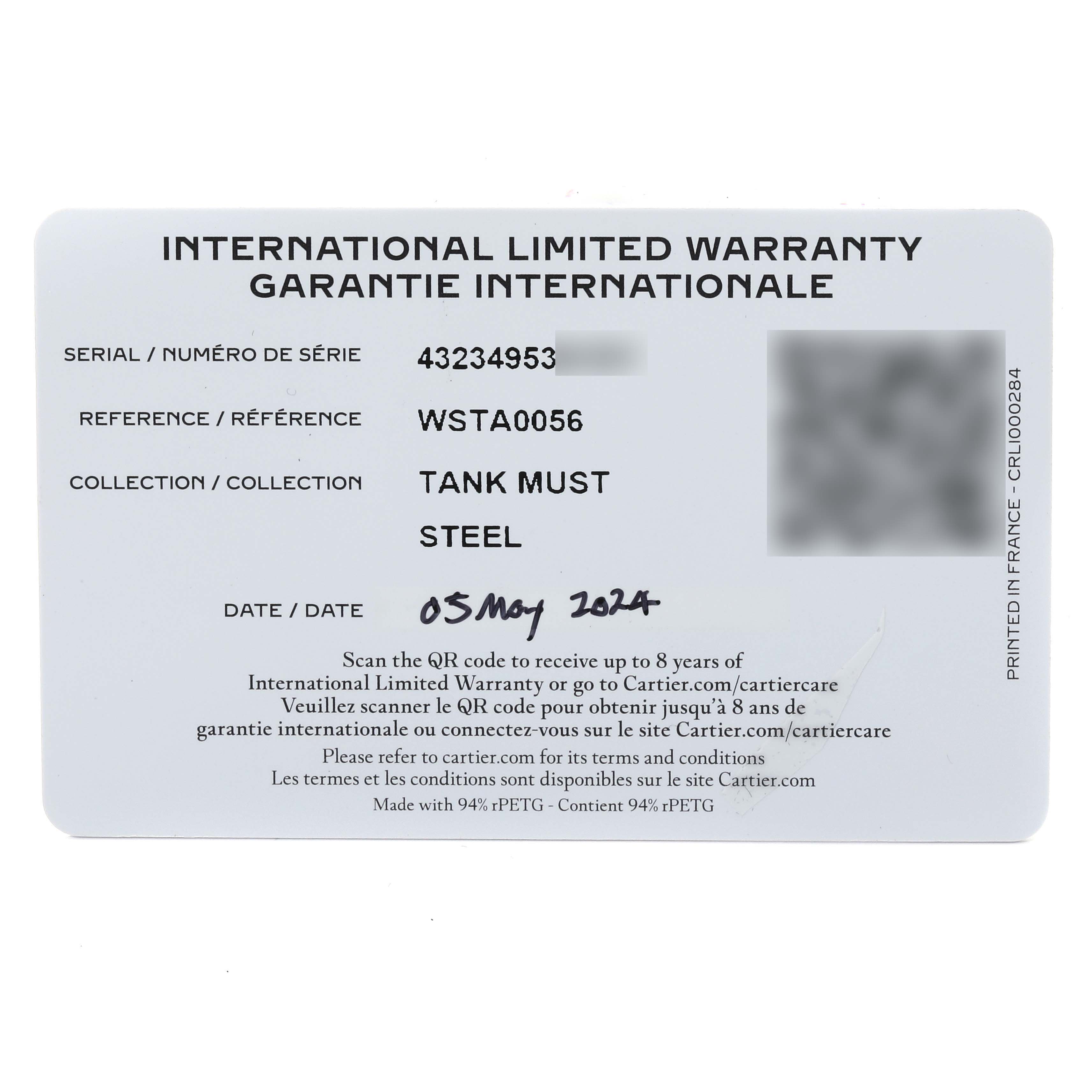 The image shows the international limited warranty card for the Cartier Tank Must WSTA0056 Women's Stainless Steel Green Dial WSTA0056 Women's Stainless Steel Green Dial model watch.