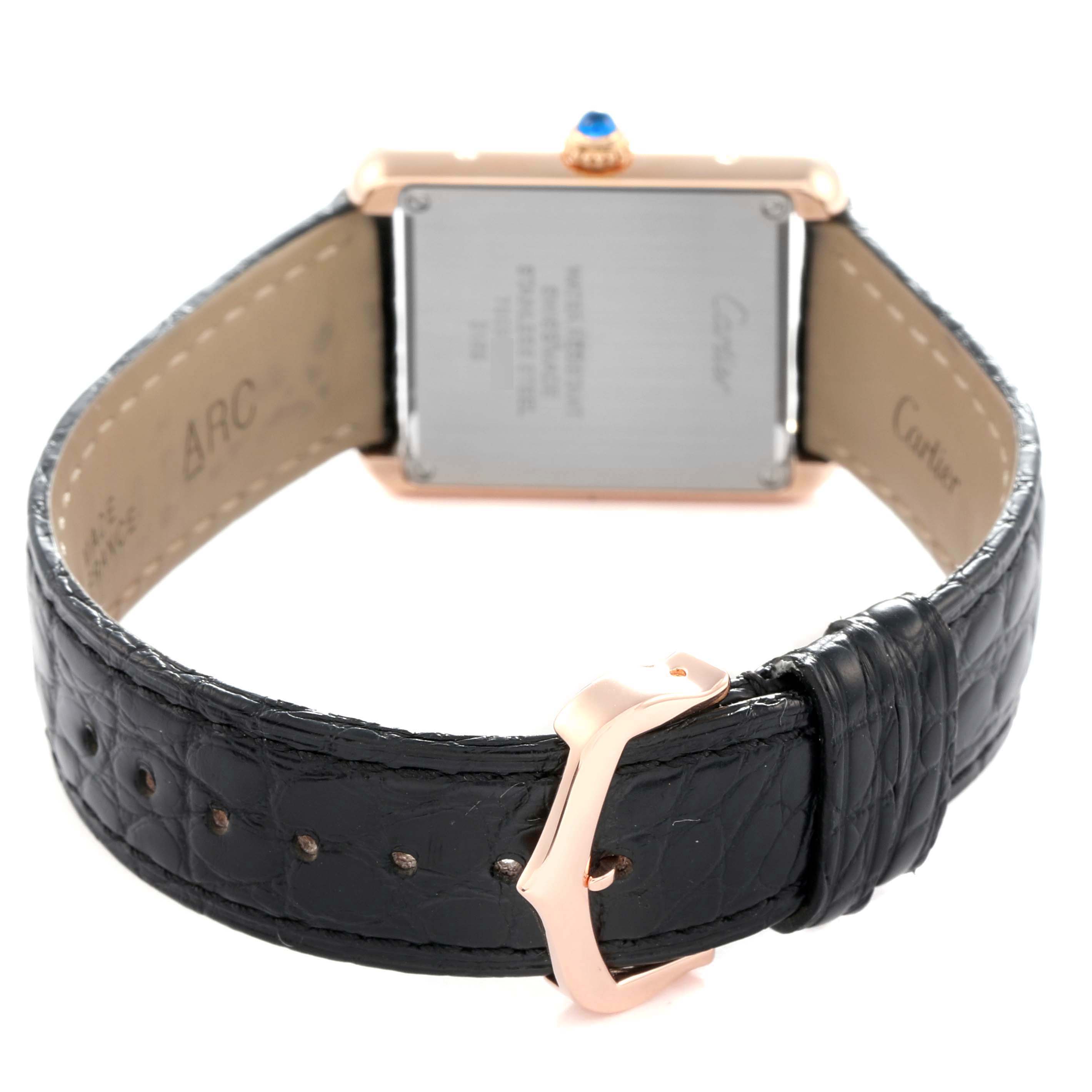 The image shows the back and side view of a Cartier Tank Solo model W5200024 men
s watch, highlighting the strap, buckle, and case back.