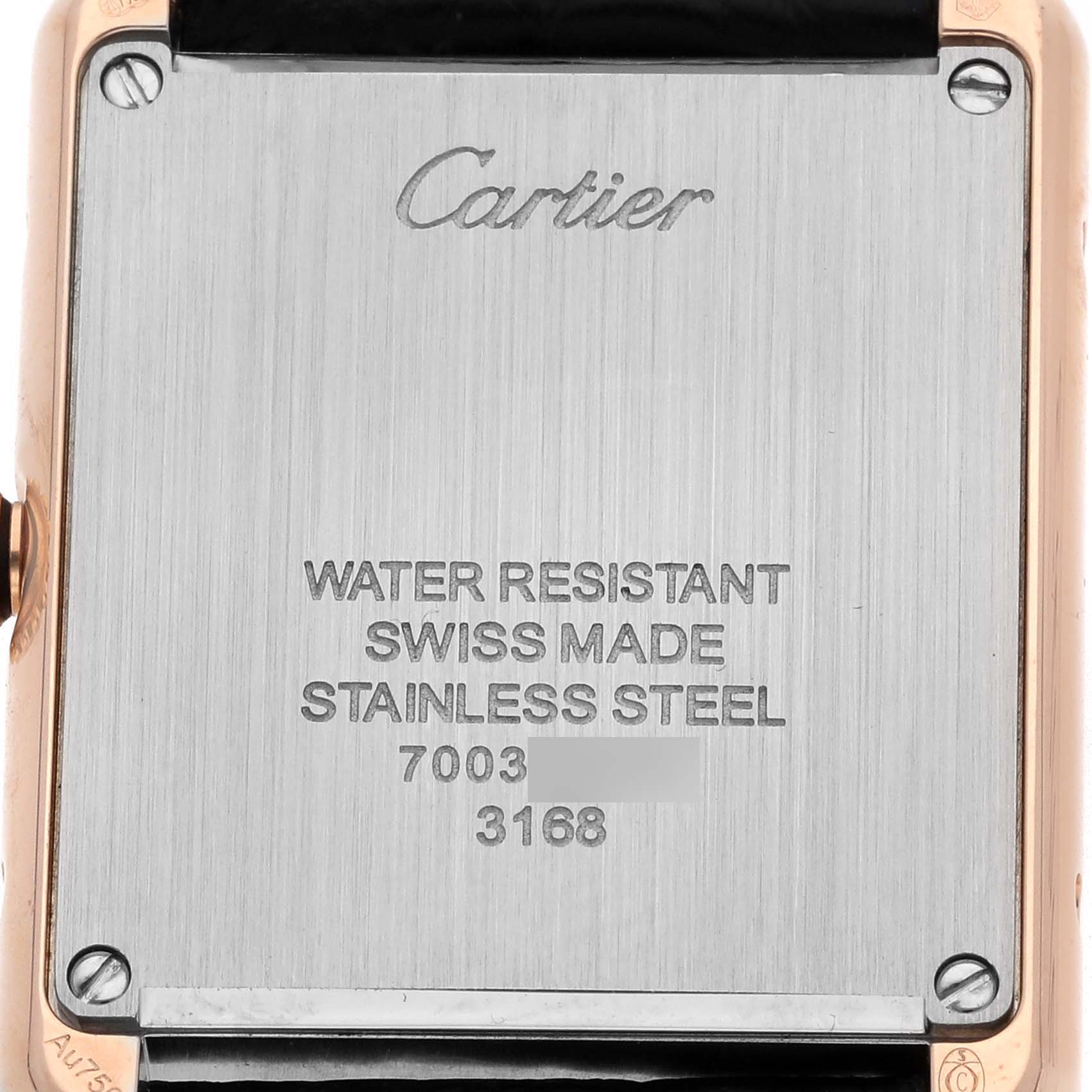 The image shows the back case of the Cartier Tank Solo model W5200024 men
s watch, displaying engraving details and screws from a straight angle.