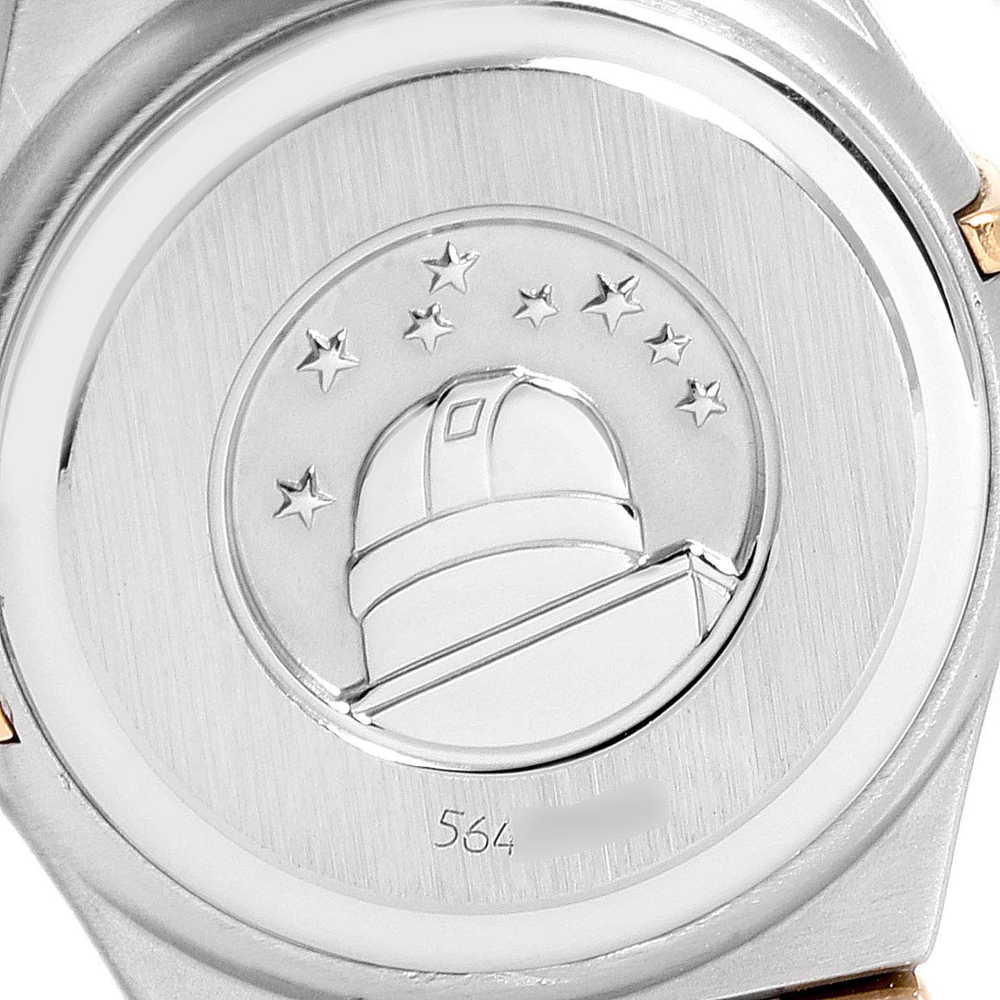 This is the back view of the Omega 1267.75.00 Women's Steel and Gold (two tone) Mother of Pearl Dial 1267.75.00 Women's Steel and Gold (two tone) Mother of Pearl Dial Constellation 95 Mother of Pearl Diamond Ladies Watch 1267.75.00, showing its embossed observatory logo.