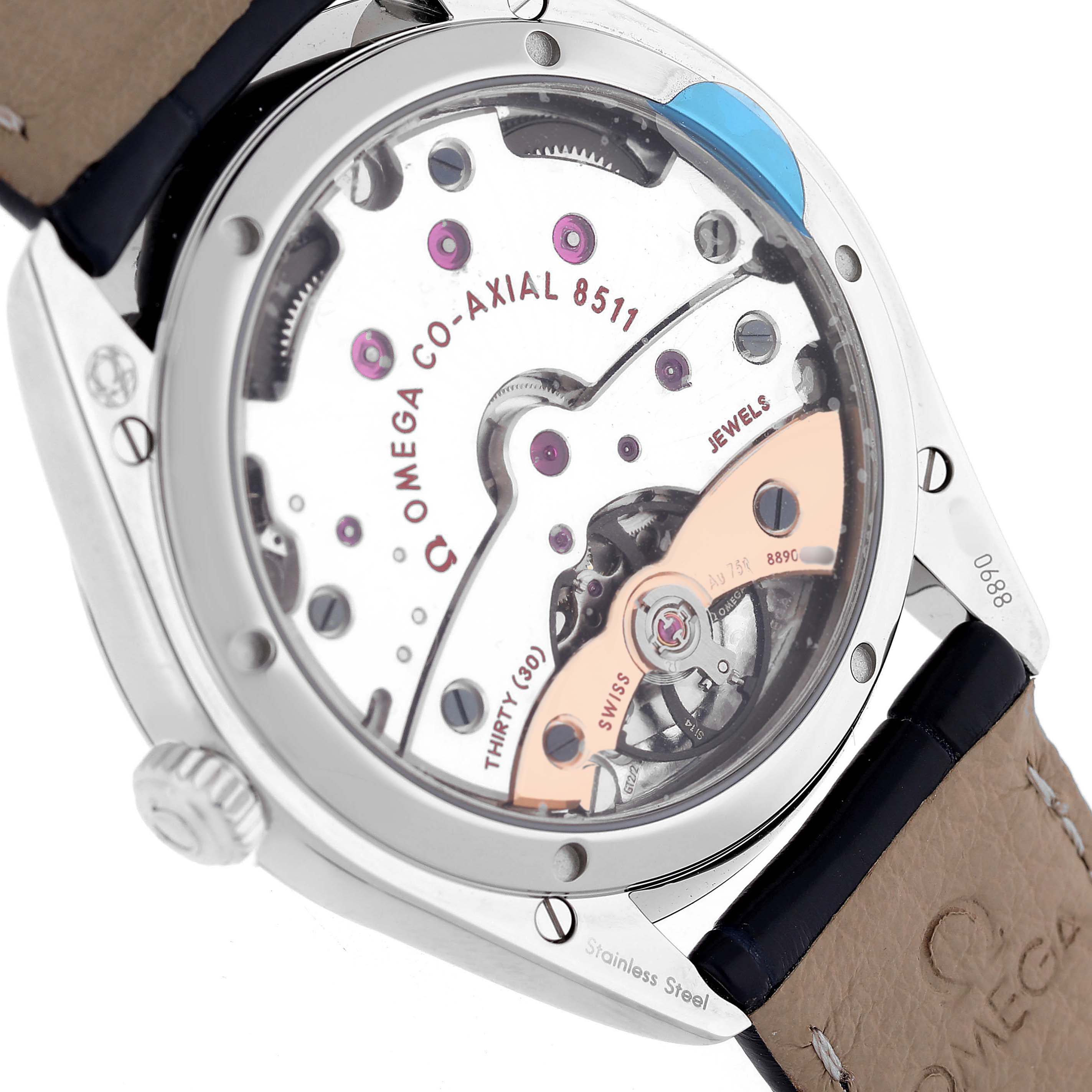 The image shows the Omega De Ville 432.18.40.21.03.001 Men's Stainless Steel Blue Dial watch from a rear angle, highlighting the Co-Axial 8511 movement and its inscriptions.