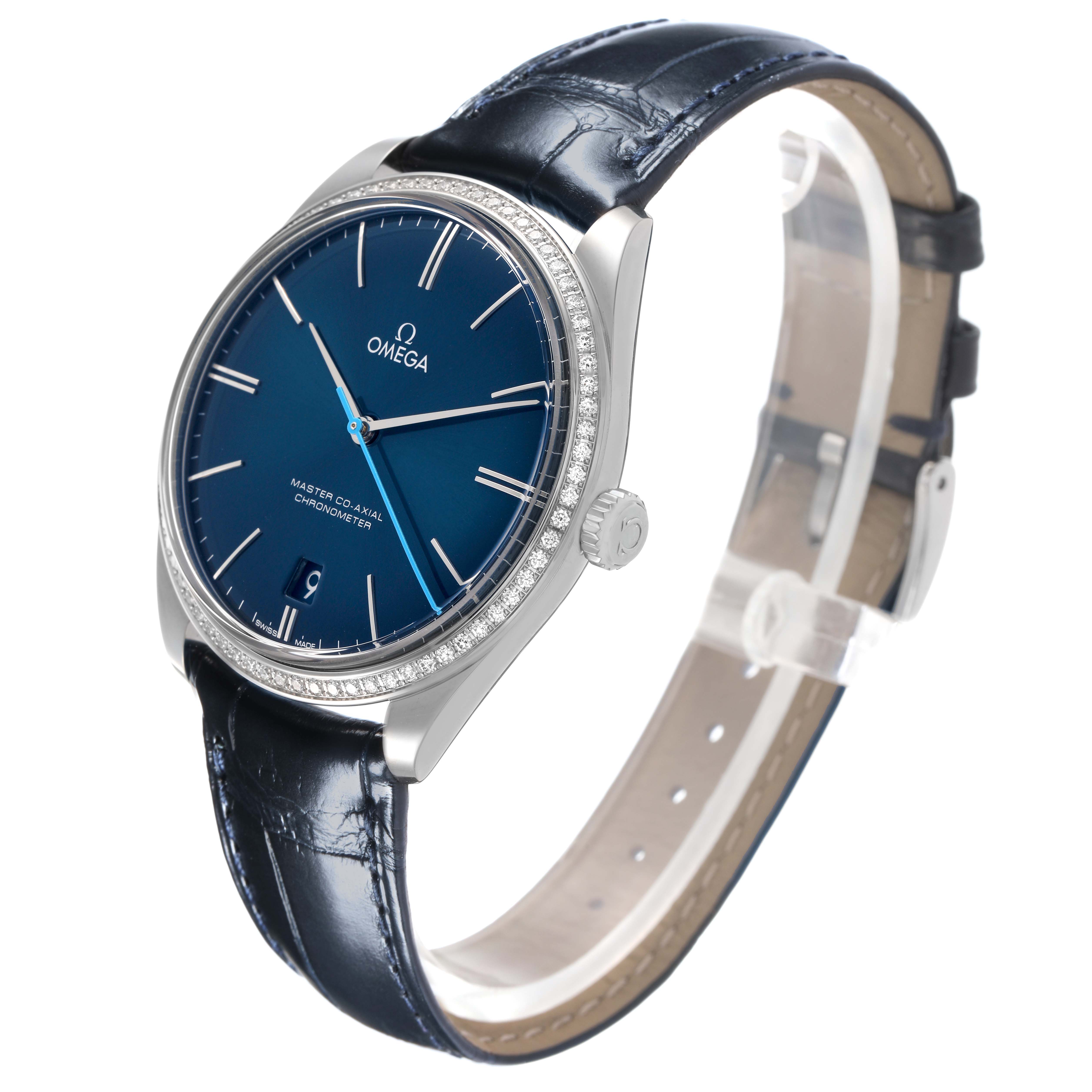 The Omega De Ville 432.18.40.21.03.001 Men's Stainless Steel Blue Dial watch is shown at a three-quarter angle, highlighting the blue dial, bezel, crown, and leather strap.