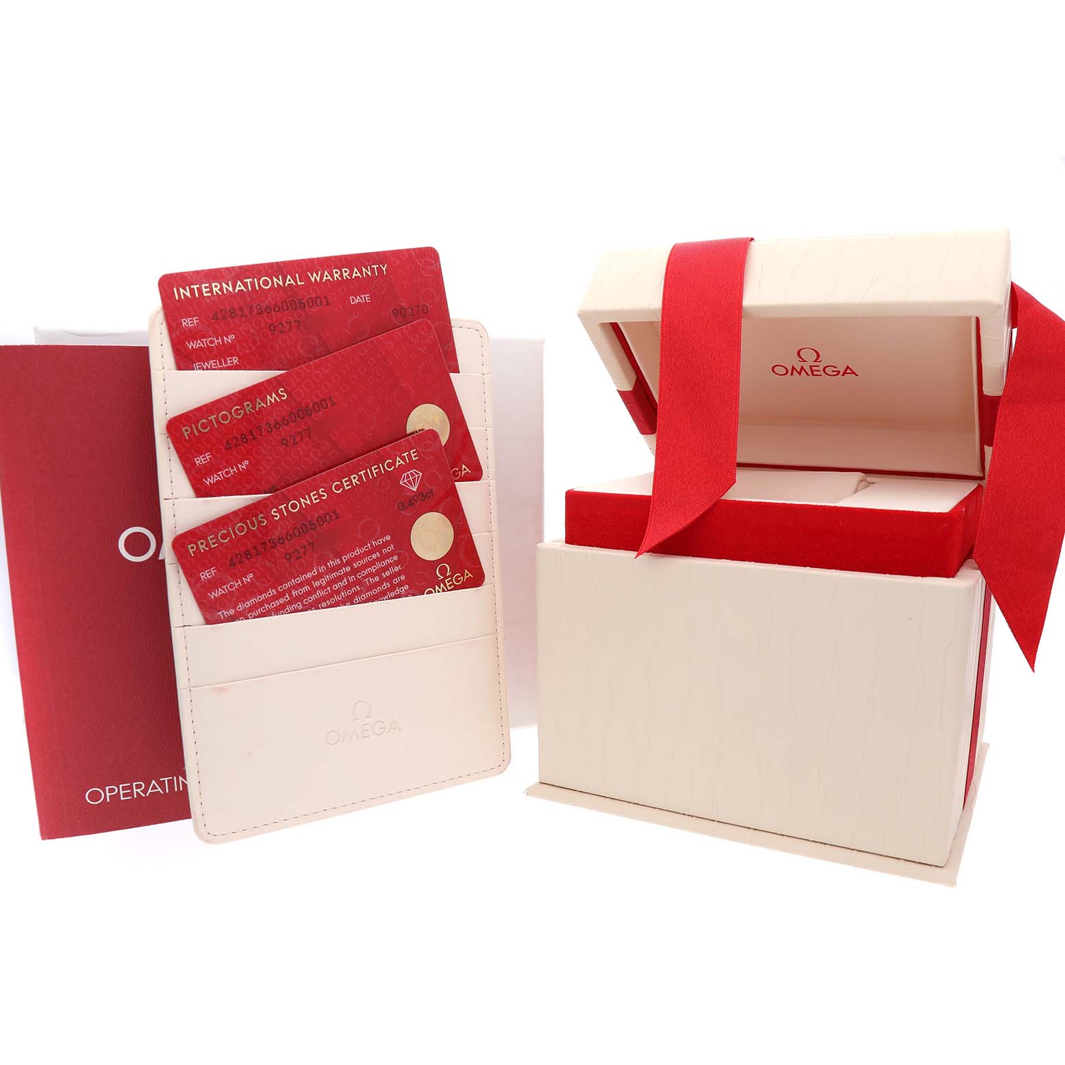 The image shows the packaging and certification cards for an Omega 428.17.36.60.05.001 Women's Stainless Steel Mother of Pearl Dial De Ville Tresor Steel Diamond Ladies Watch.