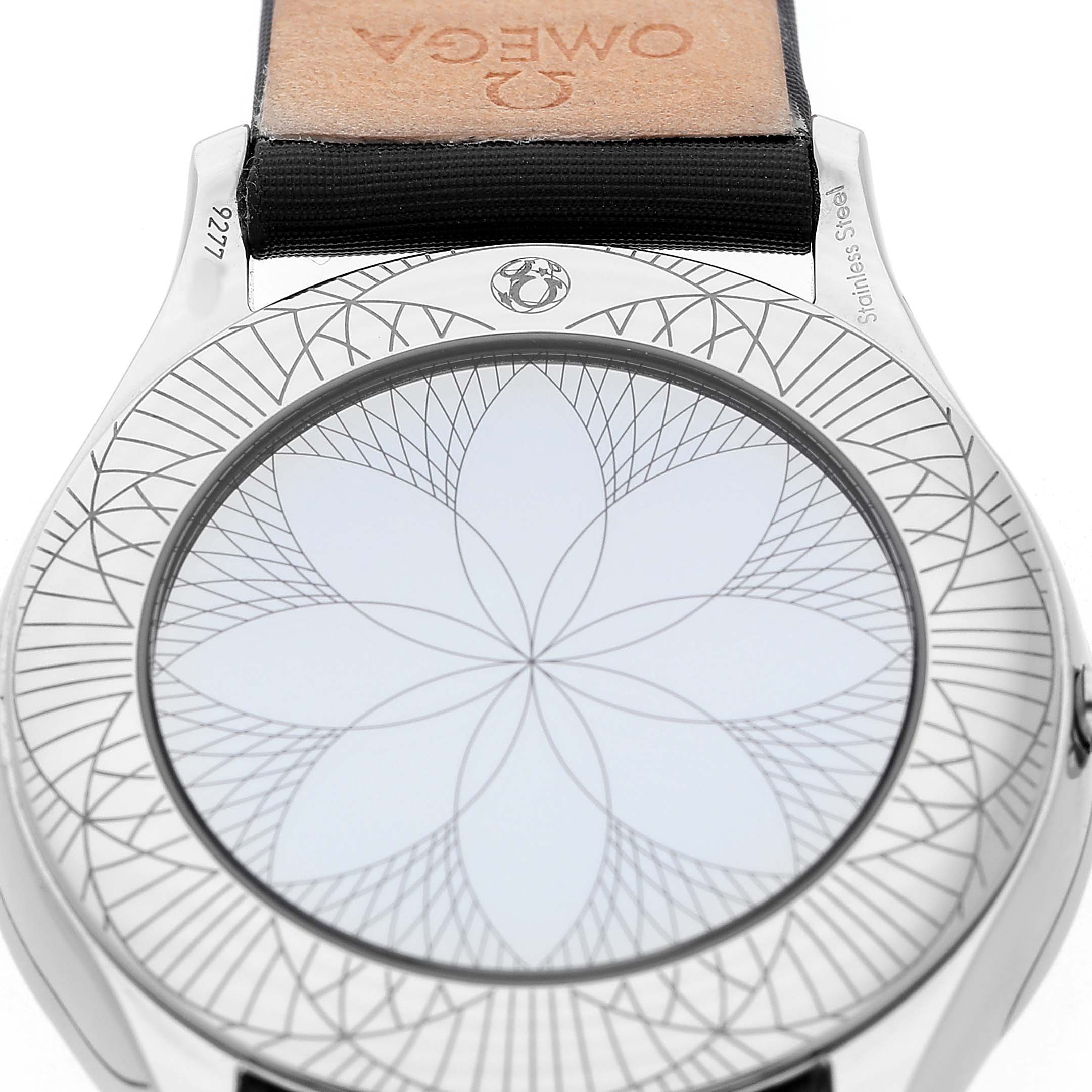 The image shows the case back of the Omega 428.17.36.60.05.001 Women's Stainless Steel Mother of Pearl Dial De Ville Tresor Steel Diamond Ladies Watch with intricate patterns and branding.