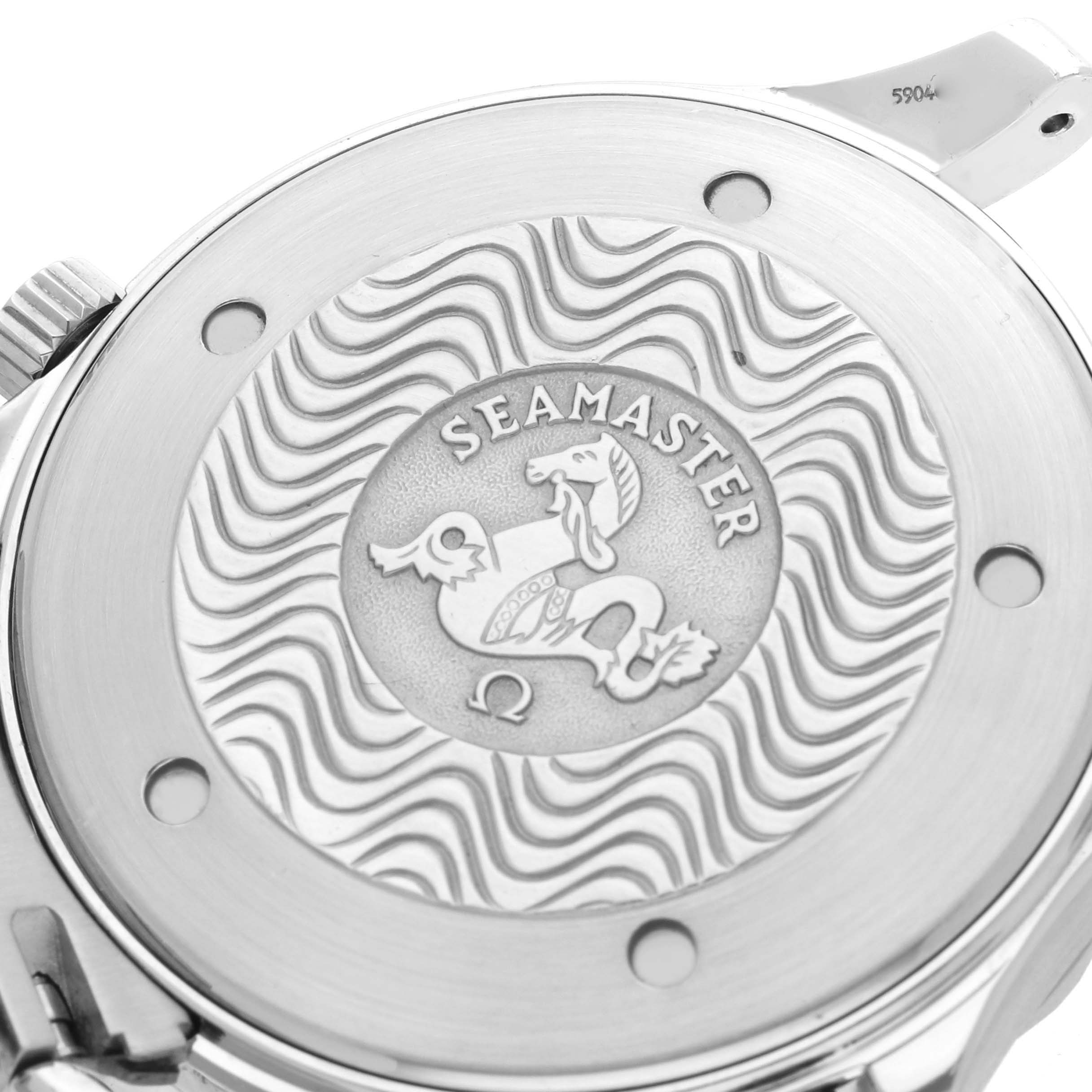 The image shows the back case of an Omega Seamaster 2541.80.00 Men
s Stainless Steel Blue Dial watch, featuring the engraved emblem and wave pattern.