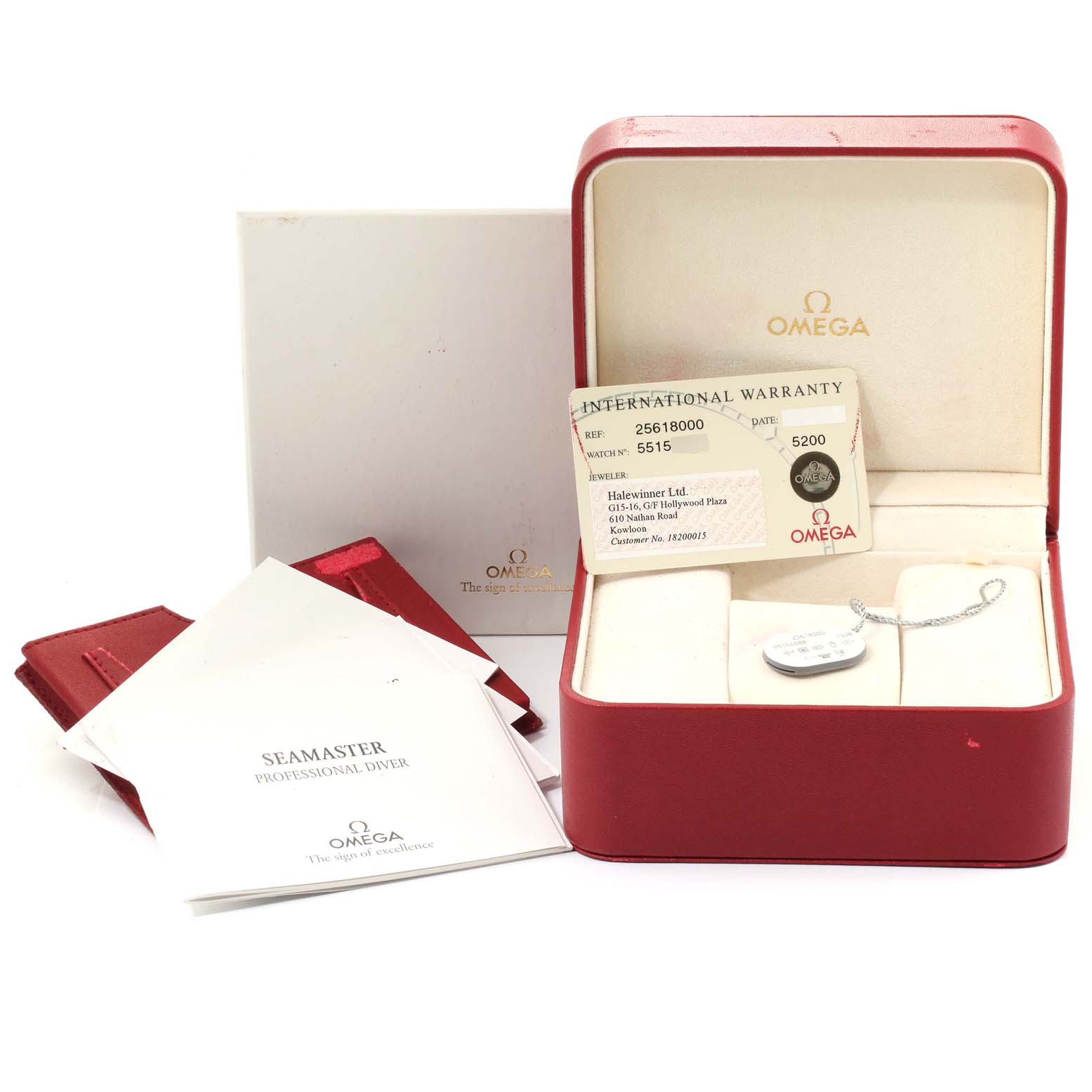 The image shows an Omega Seamaster 2561.80.00 Men
s Stainless Steel Blue Dial 2561.80.00 Men
s Stainless Steel Blue Dial watch
s box, international warranty card, manuals, and accessory tag.