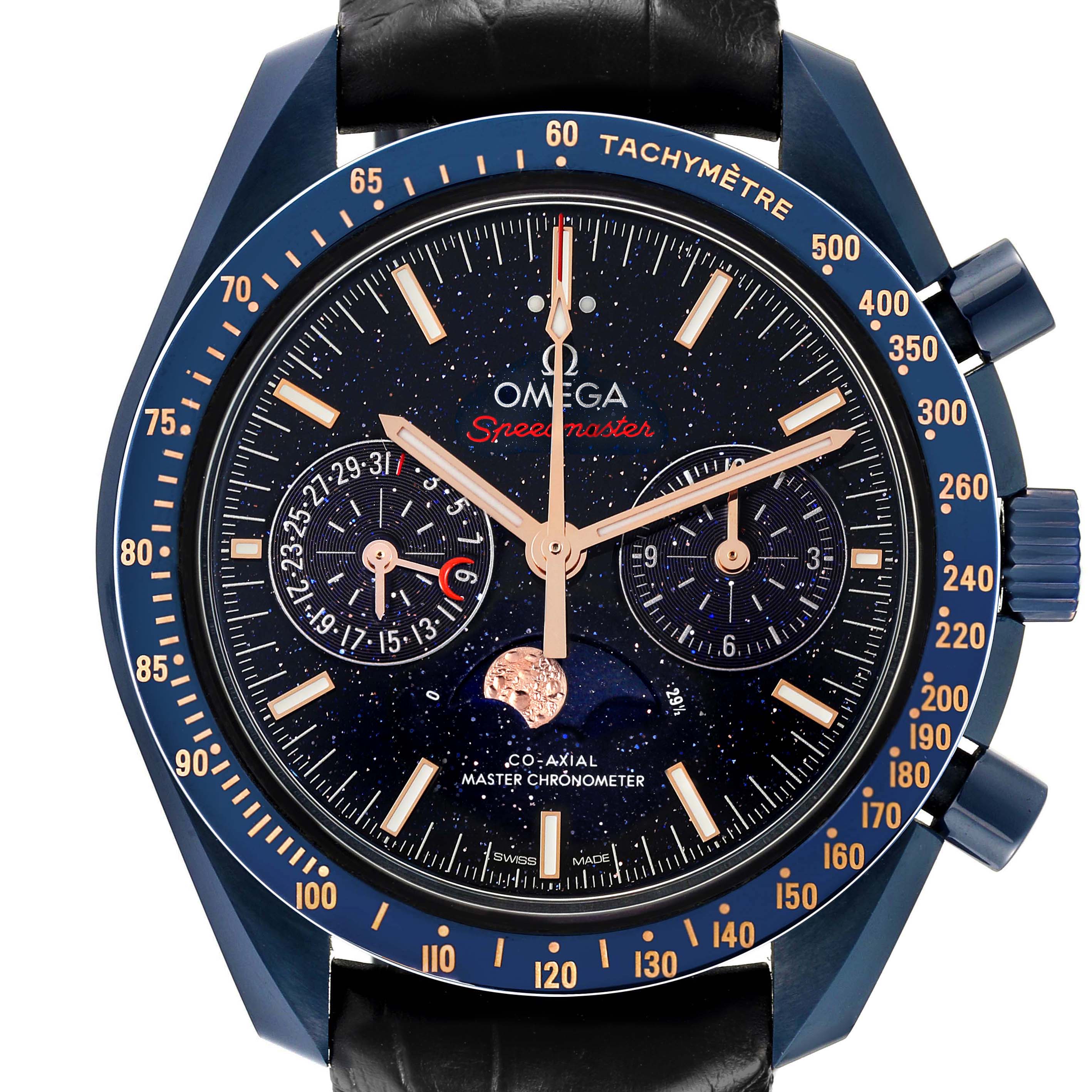 The Omega Speedmaster 304.93.44.52.03.002 Men's Ceramic Blue Dial watch is shown from a front angle, displaying the face, subdials, hands, and tachymetric bezel.