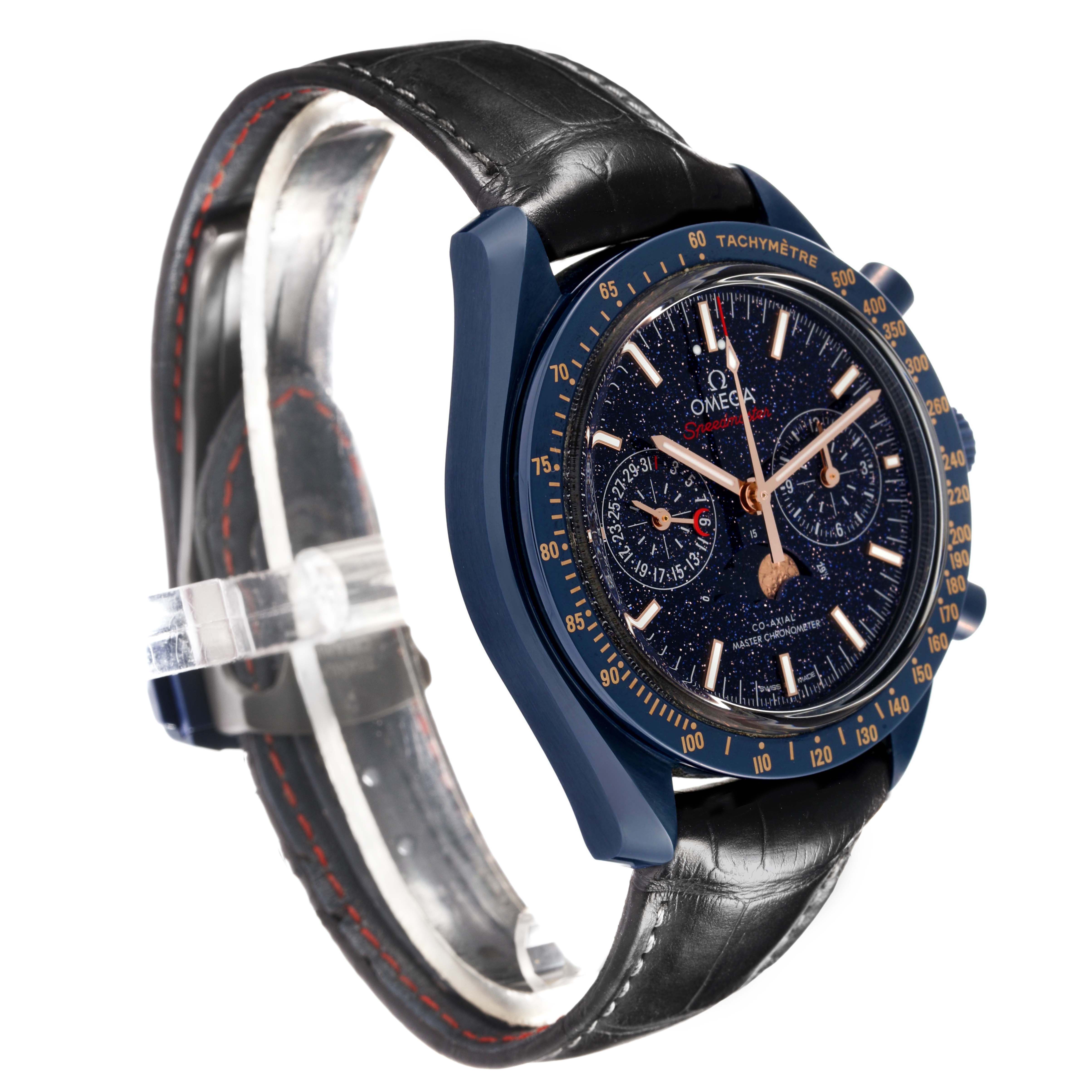 The image shows a side angle of an Omega Speedmaster 304.93.44.52.03.002 Men's Ceramic Blue Dial, highlighting its dial, bezel, and leather strap.