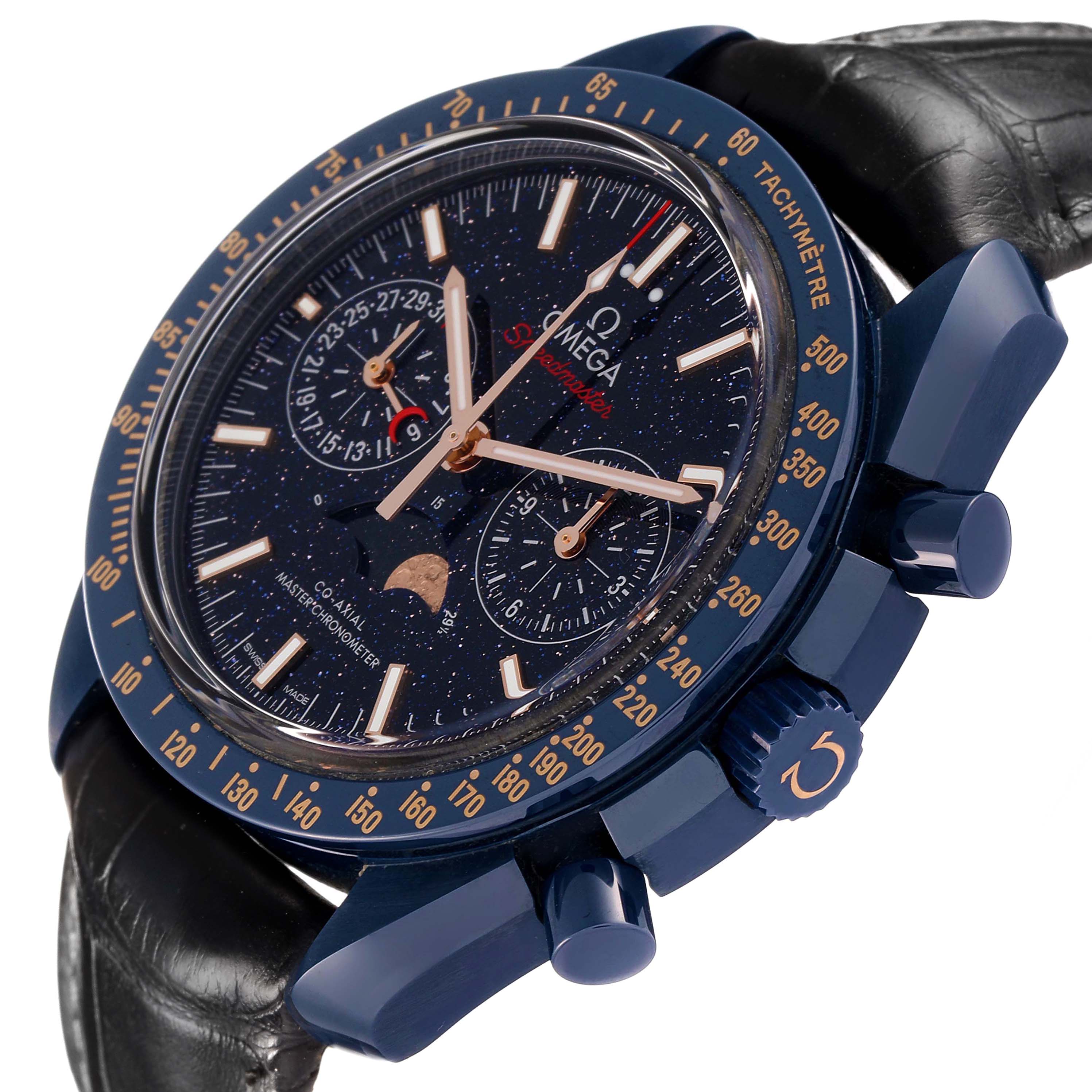 The Omega Speedmaster 304.93.44.52.03.002 Men's Ceramic Blue Dial watch is shown in a tilted side view, highlighting the face, bezel, and crown.