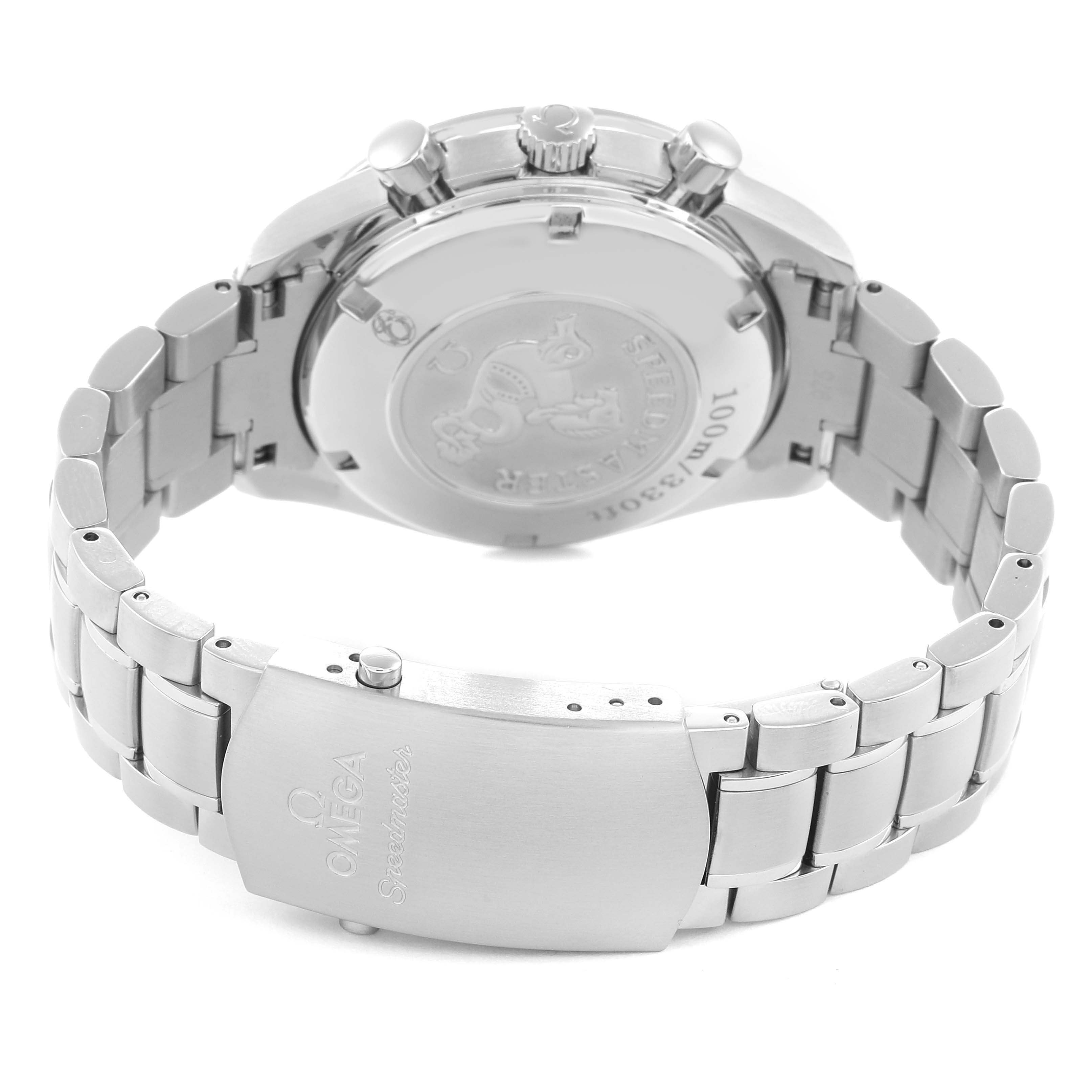 The image shows the back and clasp of the Omega Speedmaster model 3211.31.00, highlighting the engraved case back and stainless steel bracelet.