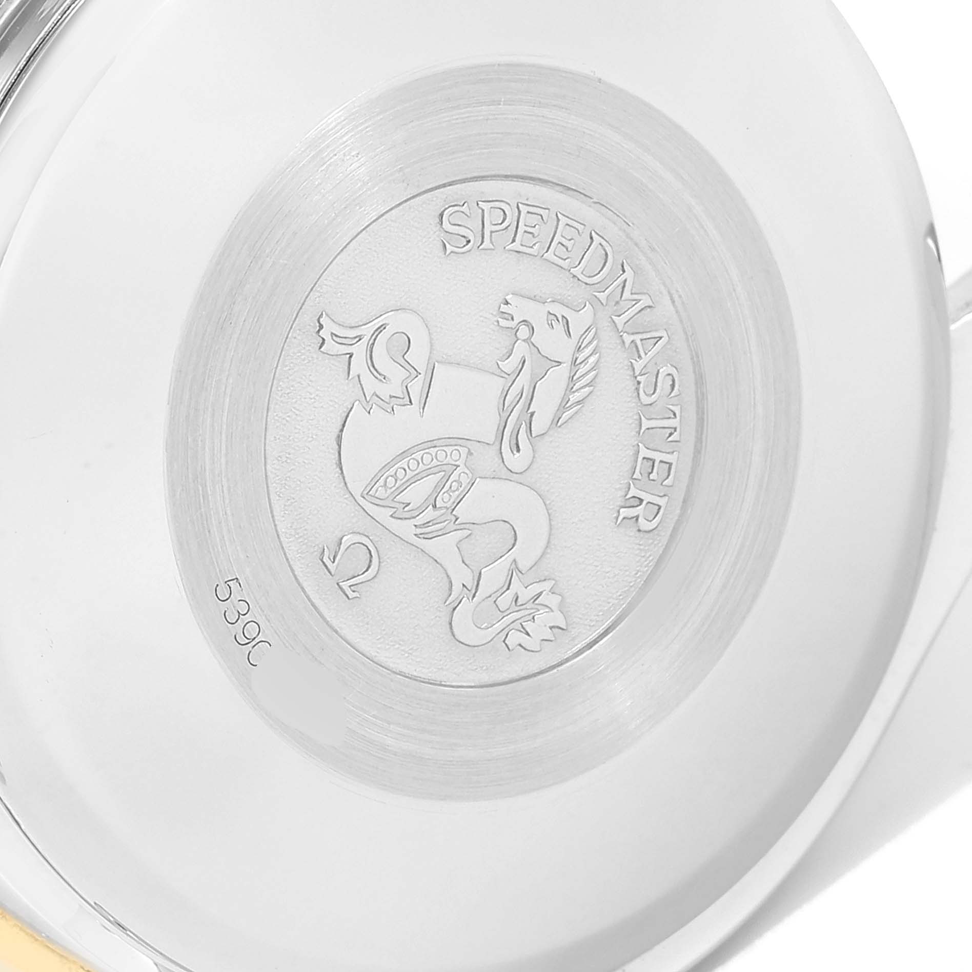 The image shows the case back of an Omega Speedmaster 3311.20.00 Men's Steel and Gold (two tone) White Dial 3311.20.00 Men's Steel and Gold (two tone) White Dial watch featuring an engraved emblem and the model name.