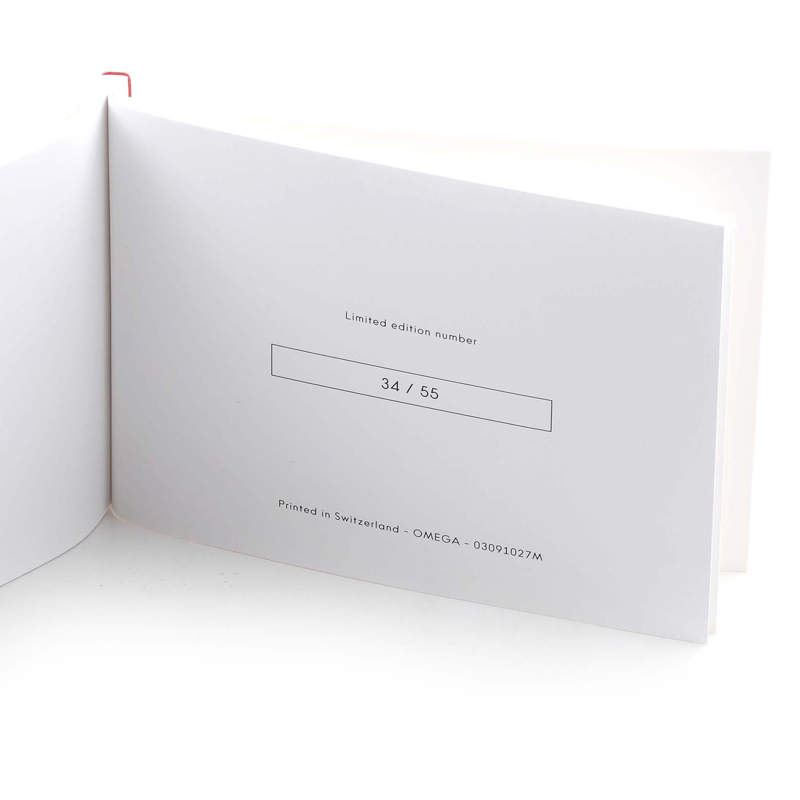 The image shows an open booklet displaying the limited edition number (34/55) for an Omega Speedmaster 522.30.42.30.06.001 Men
s Stainless Steel Black Dial 522.30.42.30.06.001 Men
s Stainless Steel Black Dial watch.