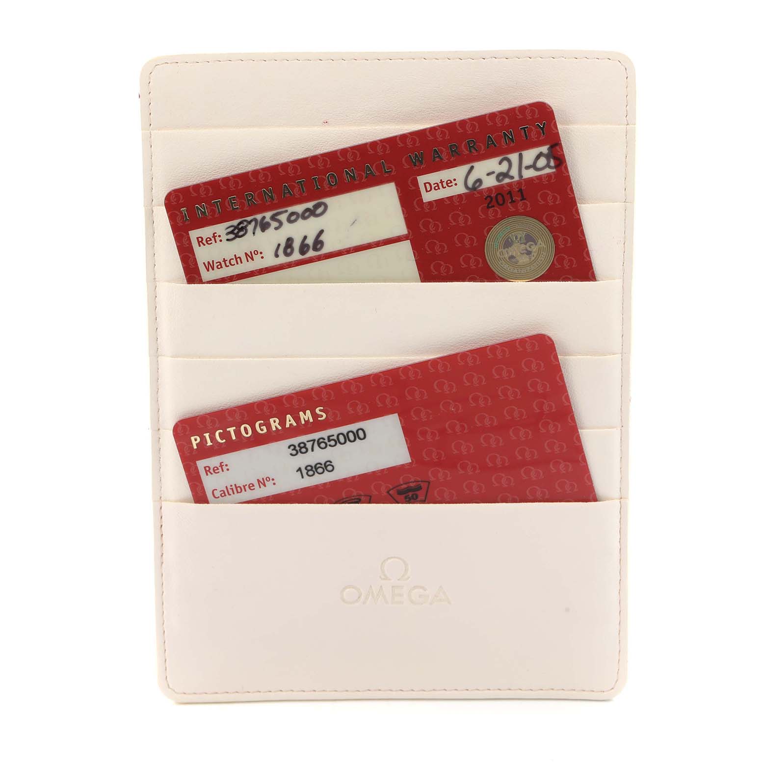 The image shows warranty and pictogram cards for an Omega Speedmaster 3876.50 Men
s Stainless Steel Black Dial watch, displayed in an Omega-branded card holder.