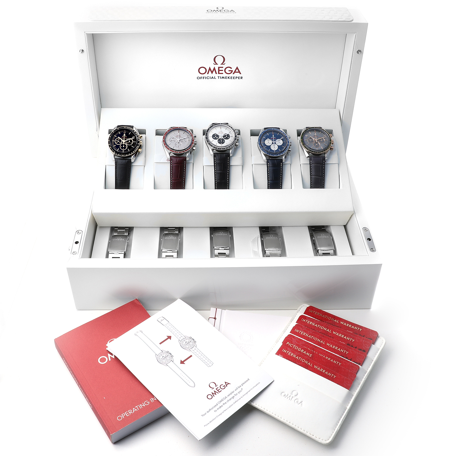 The Omega Speedmaster 522.30.42.30.04.001 Men's Stainless Steel Black Dial watches are displayed from the front in an open box, with manuals and warranty cards visible below.