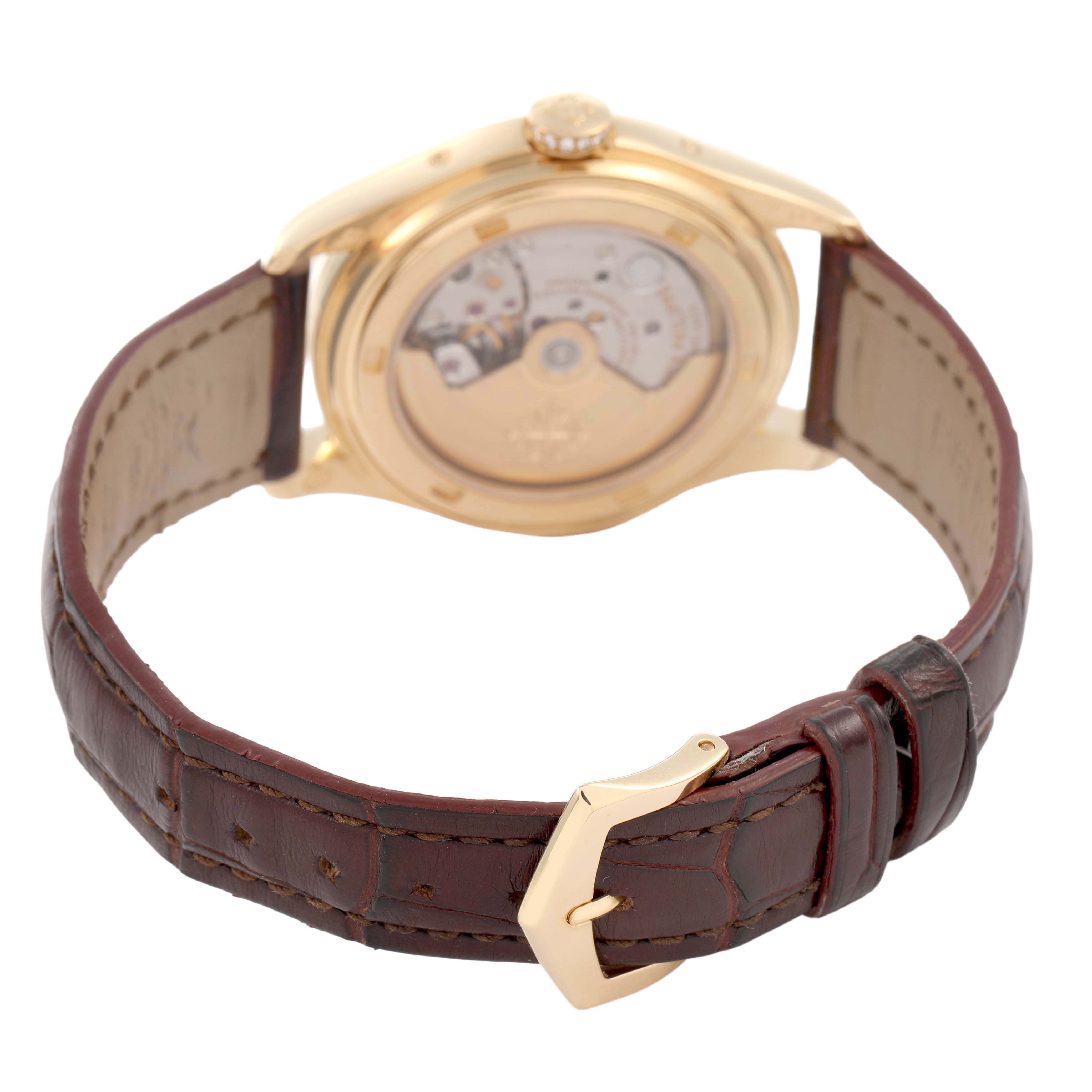The Patek Philippe Complications 4936J-001 Men's Yellow Gold Mother of Pearl Dial watch is shown from the rear, highlighting the automatic movement and leather strap.