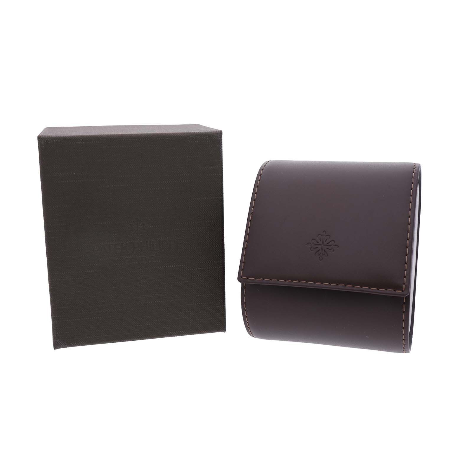 The image shows a Patek Philippe Calatrava 5123R-001 Men's Rose Gold Silver Dial watch box and leather travel case from a front angle.