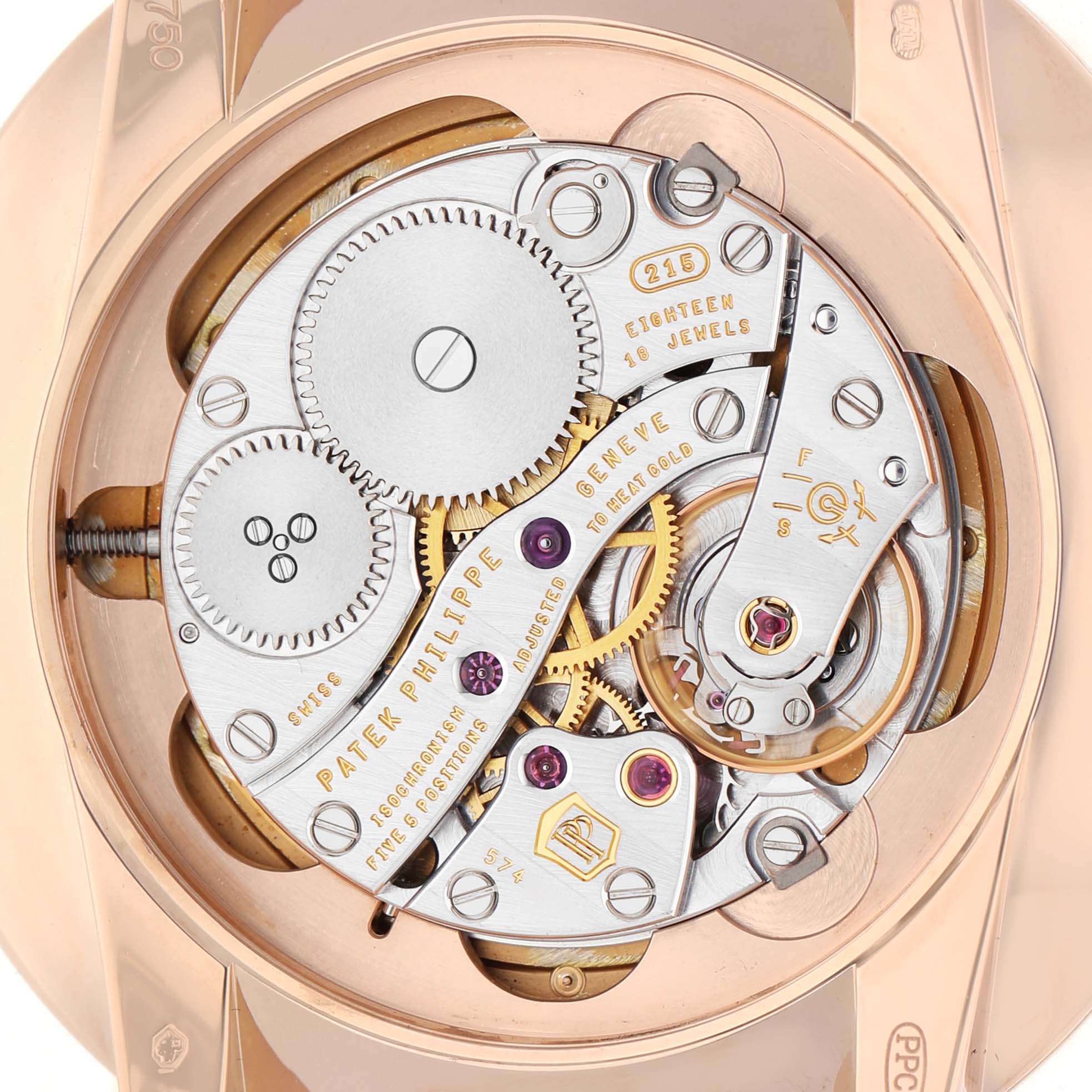 The image shows the movement and intricate mechanics of a Patek Philippe Calatrava 5123R-001 Men's Rose Gold Silver Dial watch from the back.