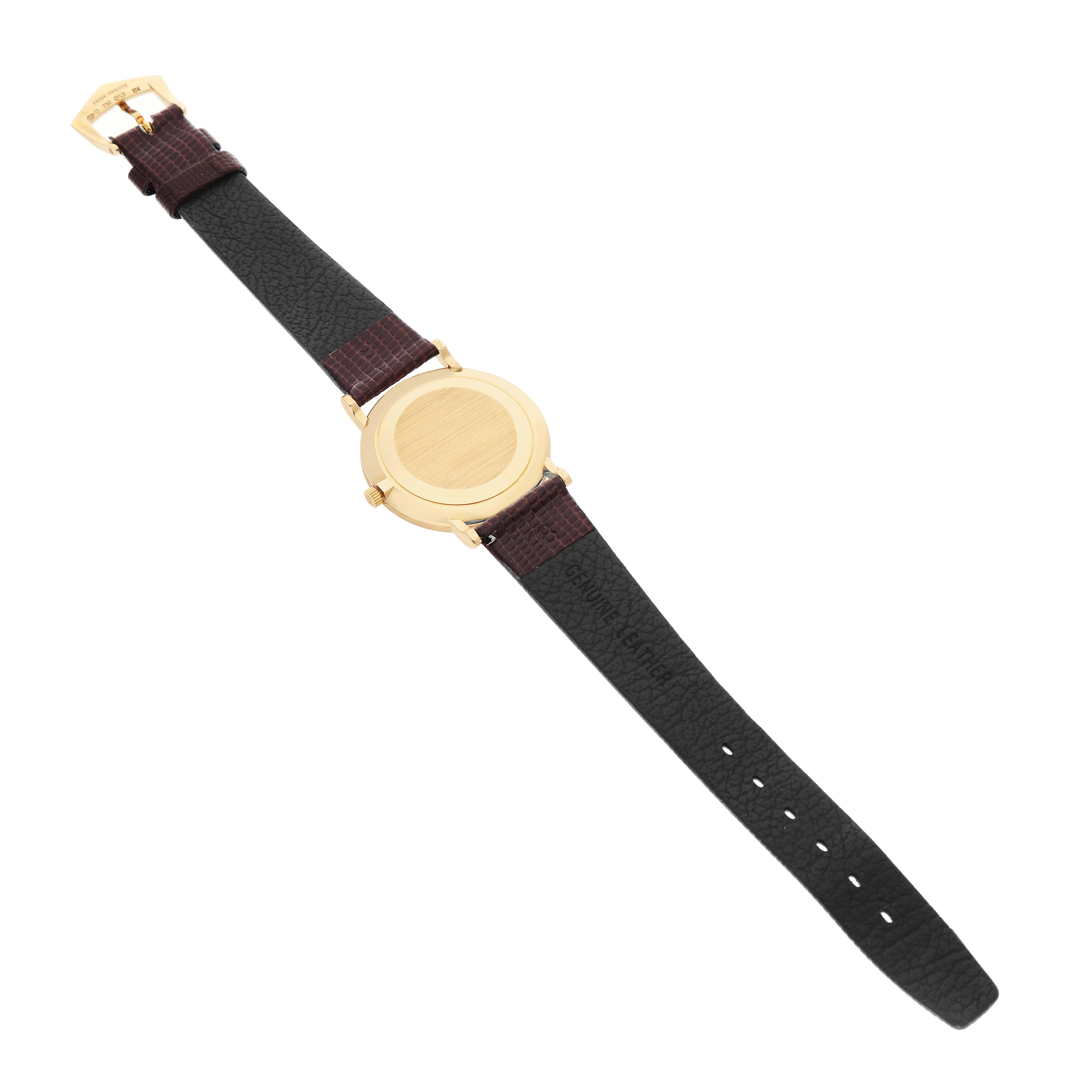 The image shows the back view of a Patek Philippe Calatrava 3919J Men's Yellow Gold White Dial watch, highlighting the case back and leather strap.