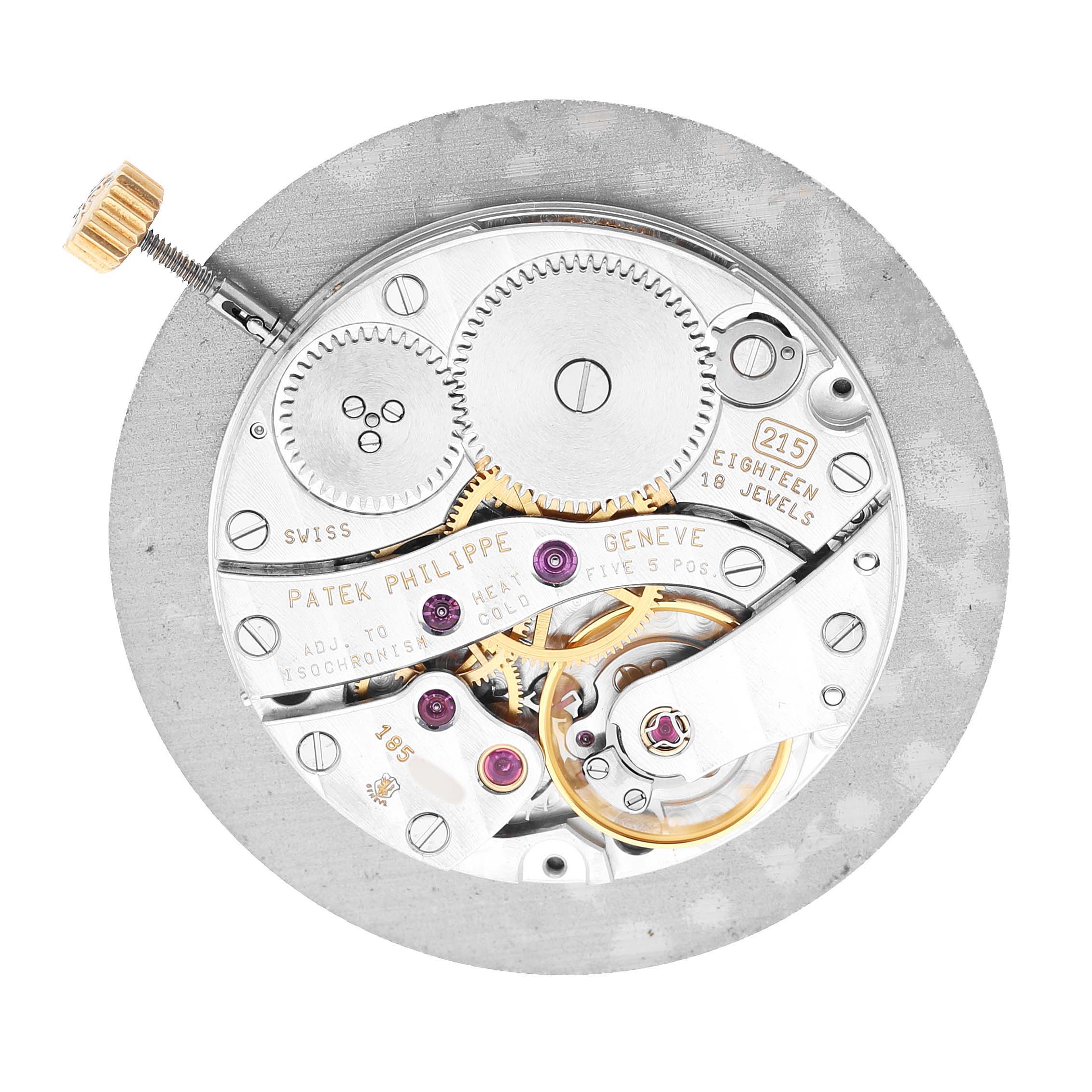 The image shows the back view of the Patek Philippe Calatrava 3919J Men's Yellow Gold White Dial movement, displaying gears, jewels, and the winding mechanism.