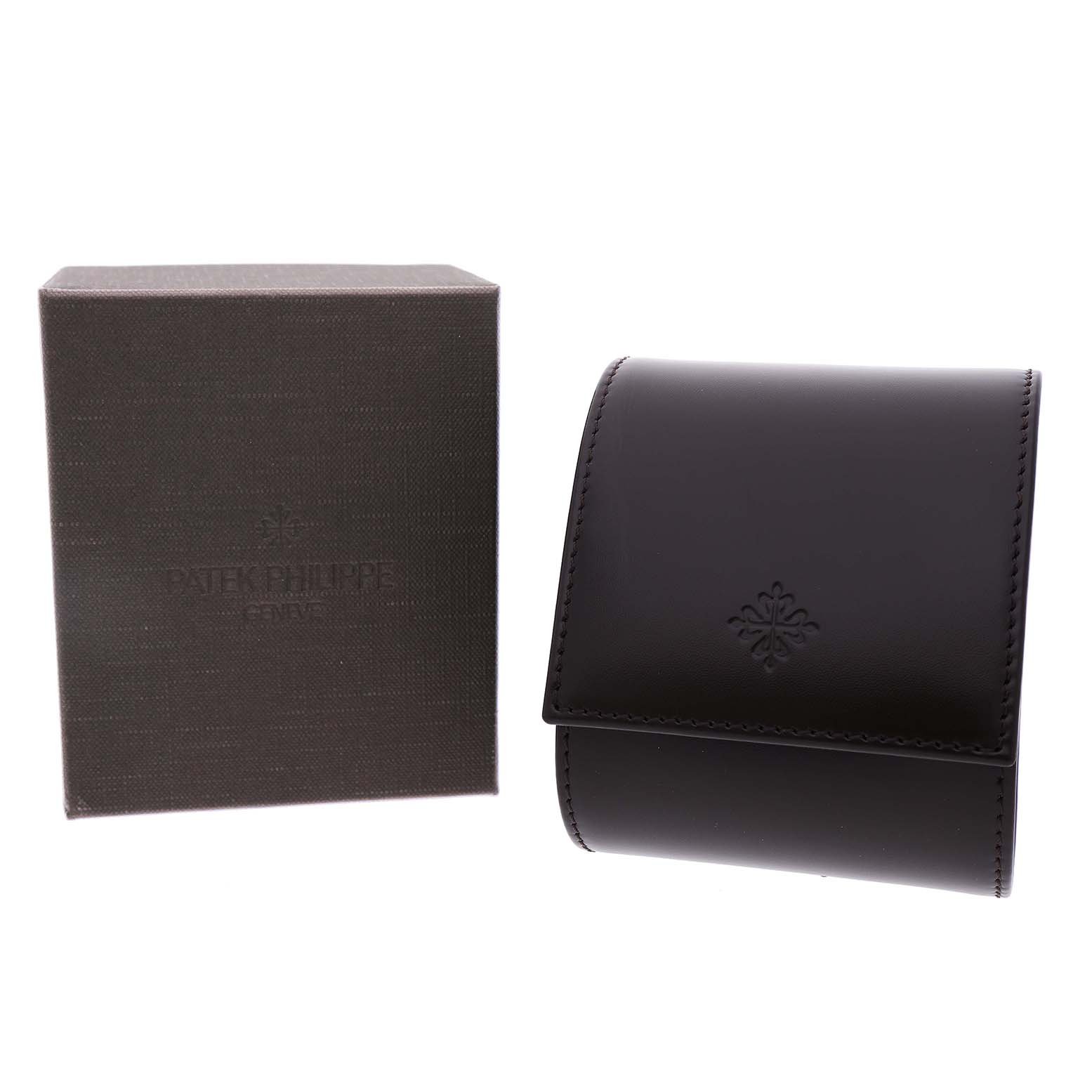 The image shows a Patek Philippe Calatrava 3919J Men's Yellow Gold White Dial watch box and leather pouch, viewed from the front.