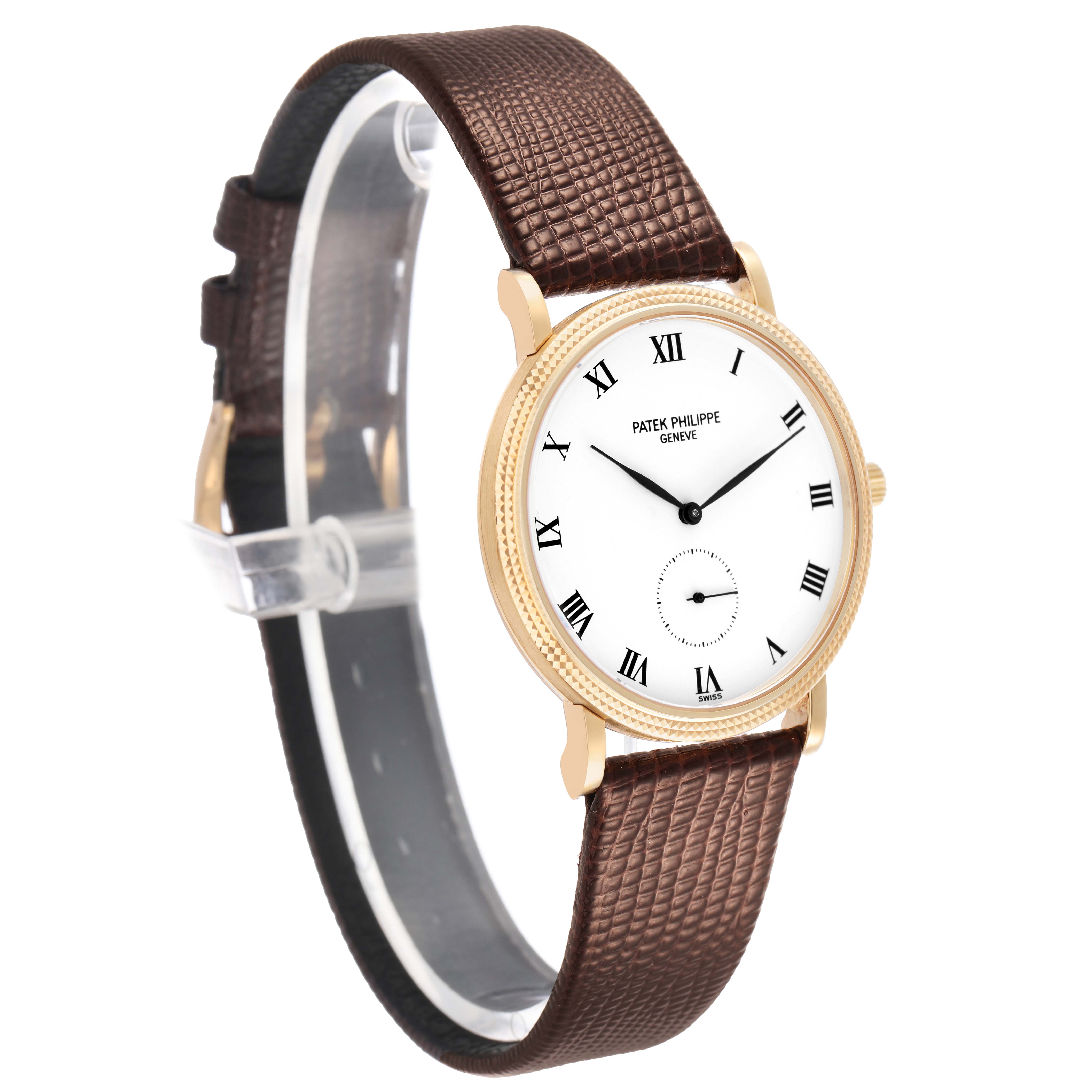 The Patek Philippe Calatrava 3919J Men's Yellow Gold White Dial watch is shown at a slight angle, highlighting its face, gold case, and brown textured strap.