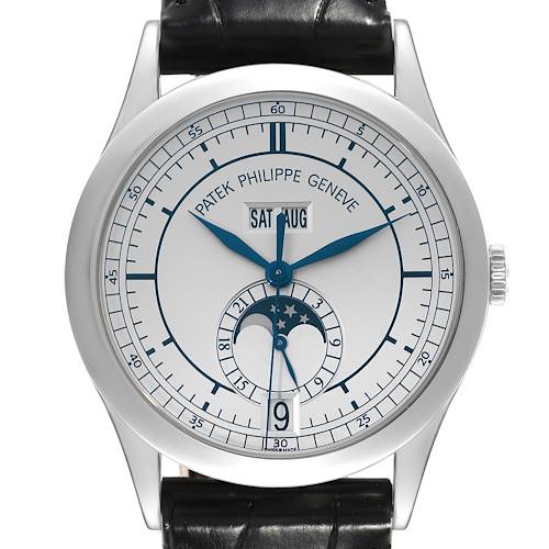 The image shows a frontal view of a Patek Philippe Complications watch, featuring a moon phase indicator and date display.