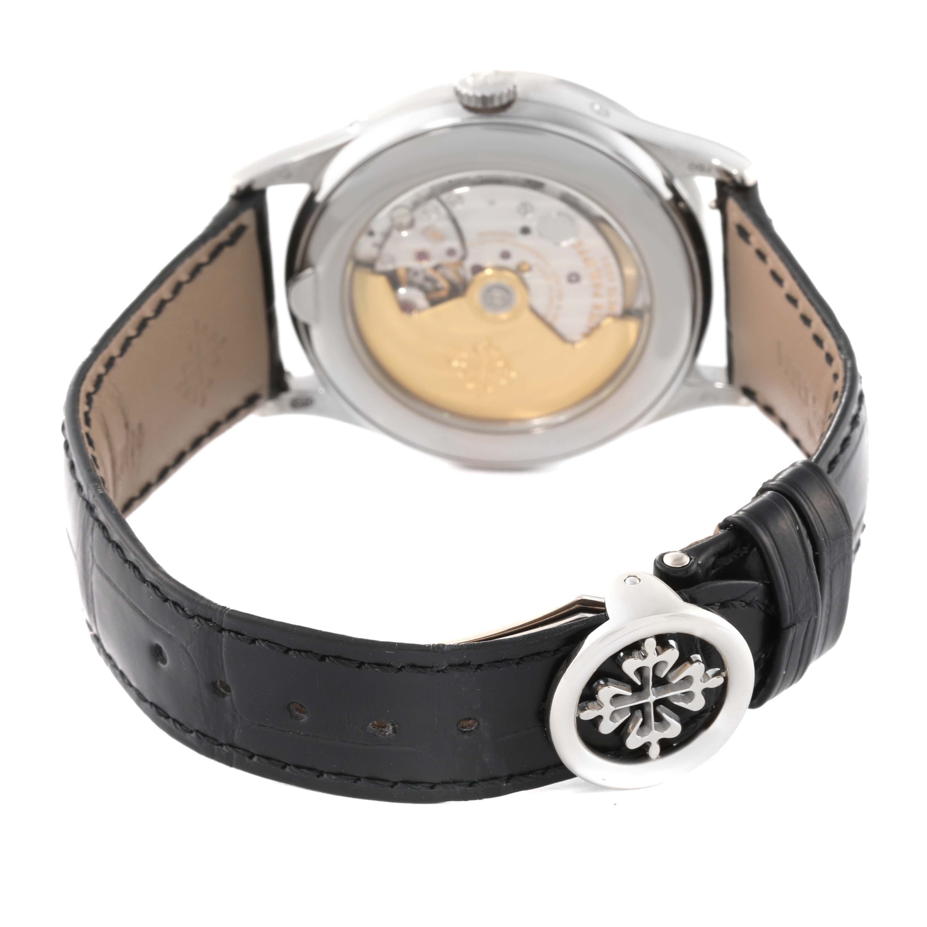 This image shows the back of the Patek Philippe Complications 5396G Men
s White Gold Silver Dial 5396G Men
s White Gold Silver Dial watch, highlighting the movement and black leather strap with the clasp.