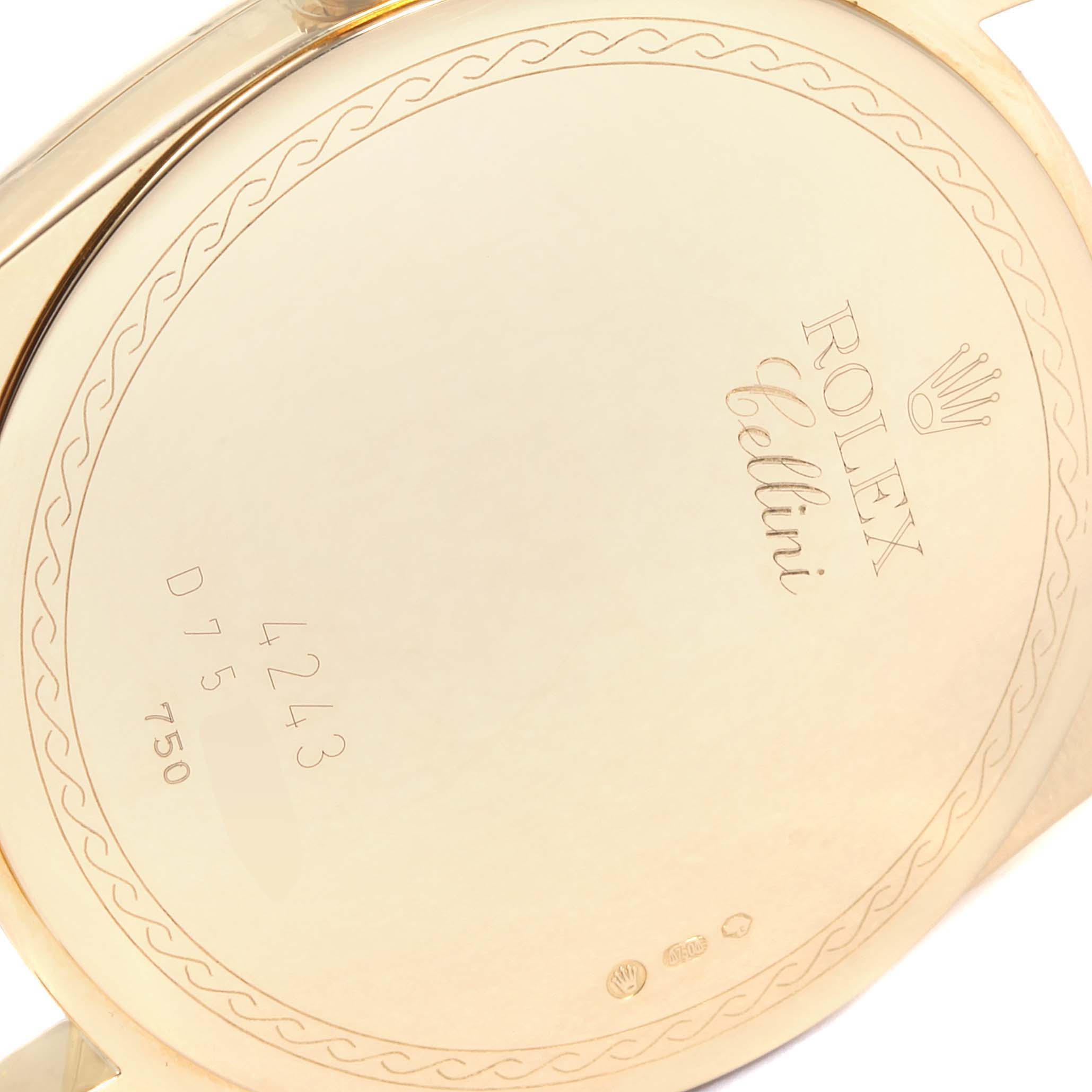 The image shows a close-up of the back case of a Rolex Cellini 4243 Men's Yellow Gold White Dial 4243 Men's Yellow Gold White Dial watch, focusing on the engraved details and markings.