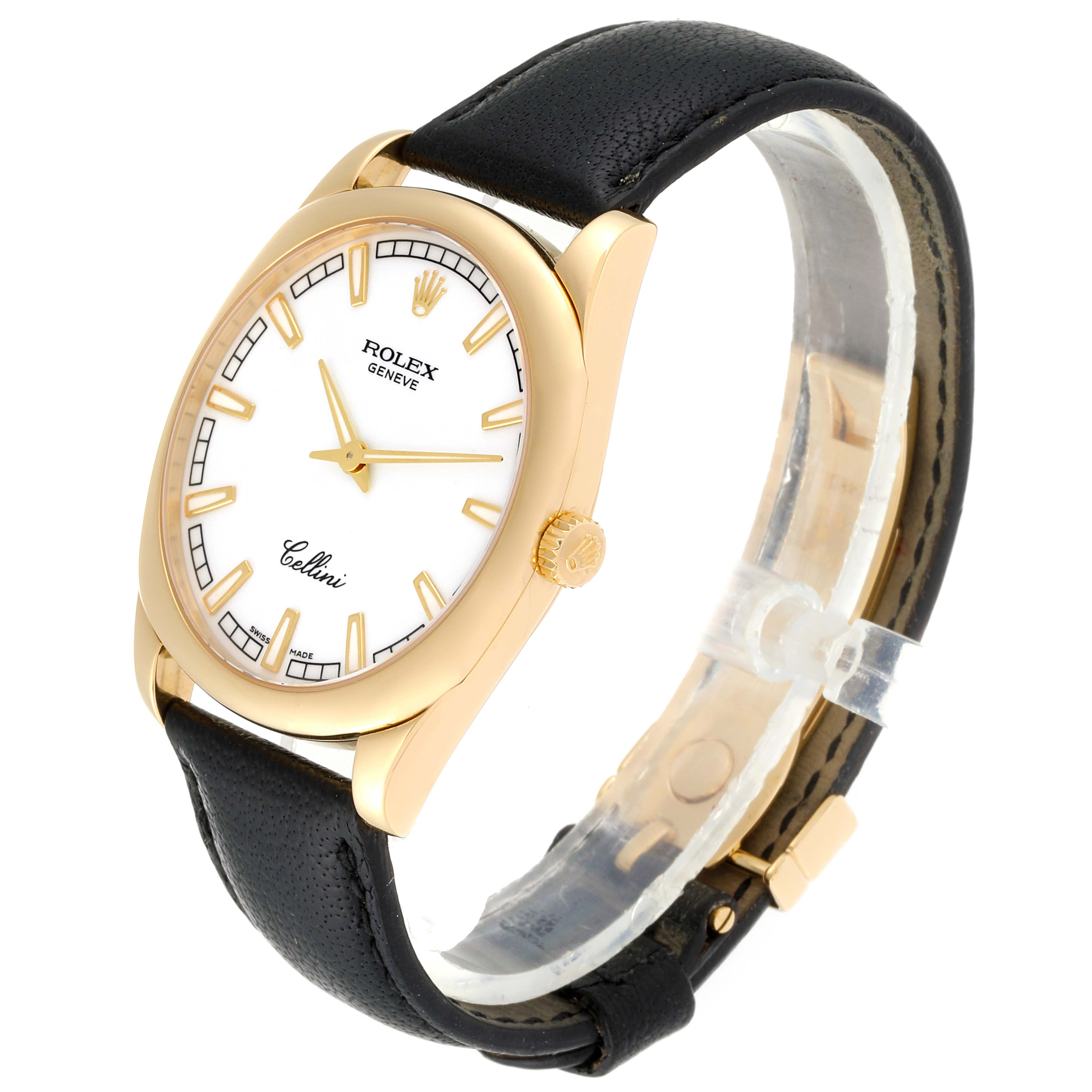 This image shows a side angle of the Rolex Cellini 4243 Men's Yellow Gold White Dial 4243 Men's Yellow Gold White Dial watch, highlighting its face, gold case, crown, and black leather strap.