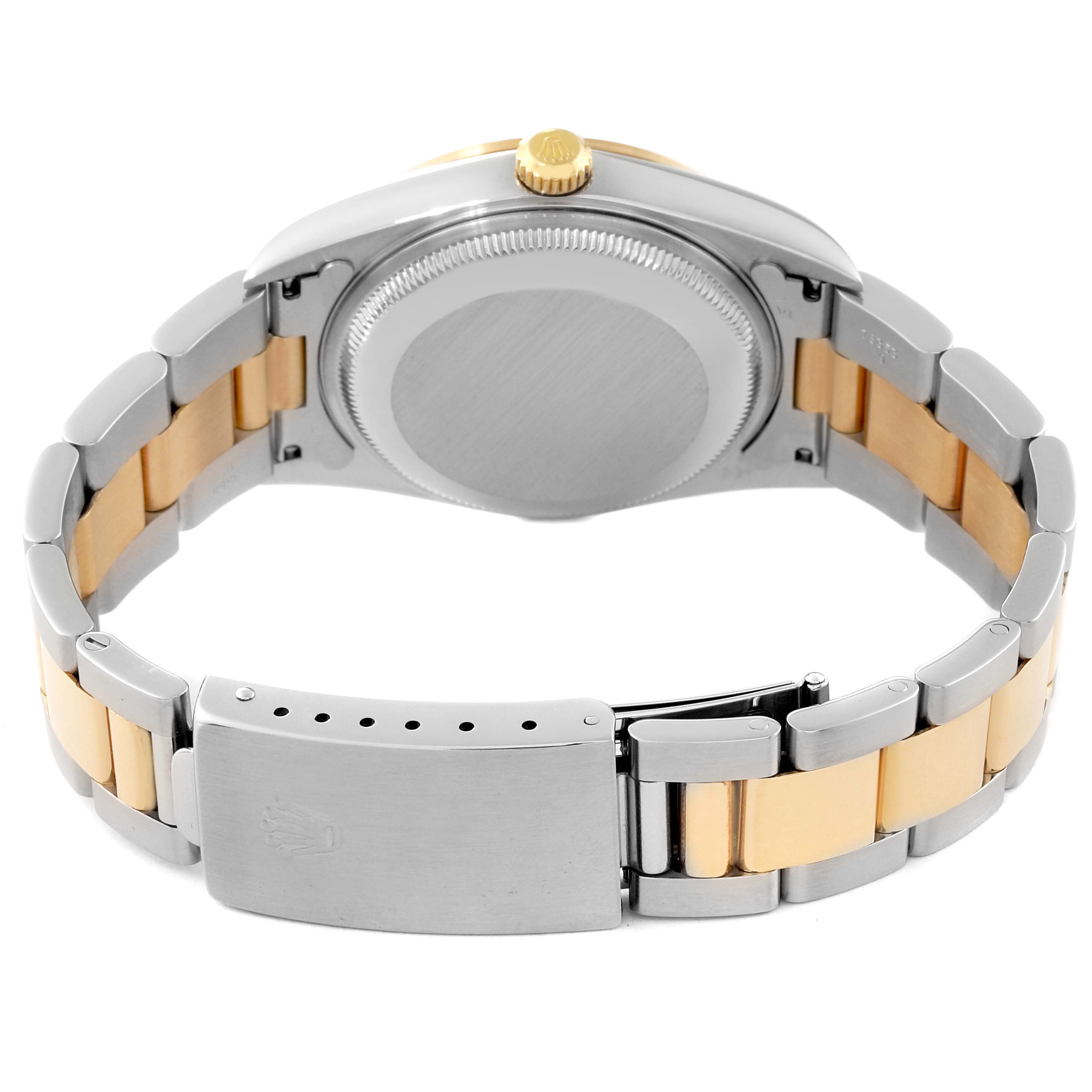 This image shows the back of a Rolex Date 15203 Men's Steel and Gold (two tone) Silver Dial 15203 Men's Steel and Gold (two tone) Silver Dial model watch, highlighting the case back, crown, and two-tone bracelet.