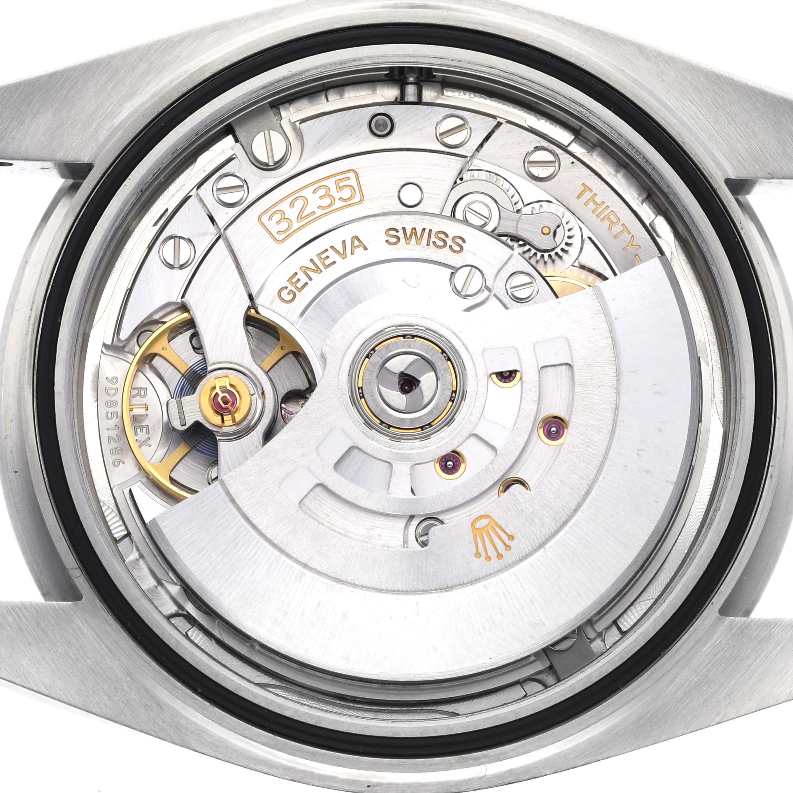 The image shows the internal mechanism of the Rolex Datejust 41 126300 Men
s Stainless Steel Silver Dial 126300 Men
s Stainless Steel Silver Dial watch, specifically the movement with the rotor and balance wheel visible.