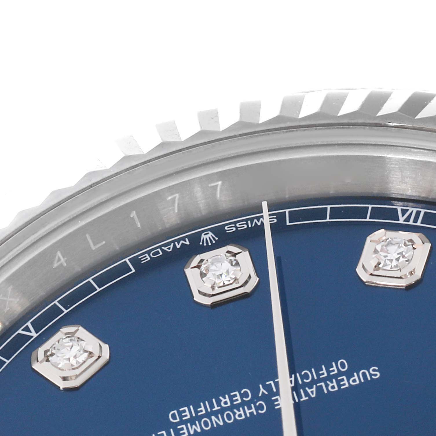 This image shows a close-up of the Rolex Datejust 41 126334 Men
s Stainless Steel Blue Dial 126334 Men
s Stainless Steel Blue Dial watch, focusing on part of the bezel, dial, and diamond hour markers.