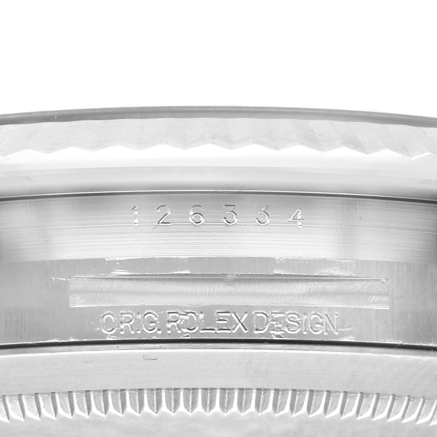 This image shows a close-up view of the model number and "ORIG. ROLEX DESIGN" engraving on a Rolex Datejust 41 126334 Men
s Stainless Steel Blue Dial 126334 Men
s Stainless Steel Blue Dial watch case.