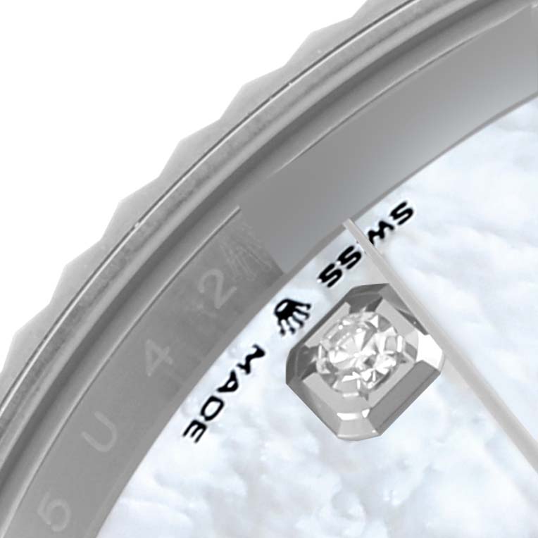 The image shows a partial close-up of the Rolex Datejust 41, model 126334NG, focusing on the bezel, a diamond hour marker, and part of the dial.