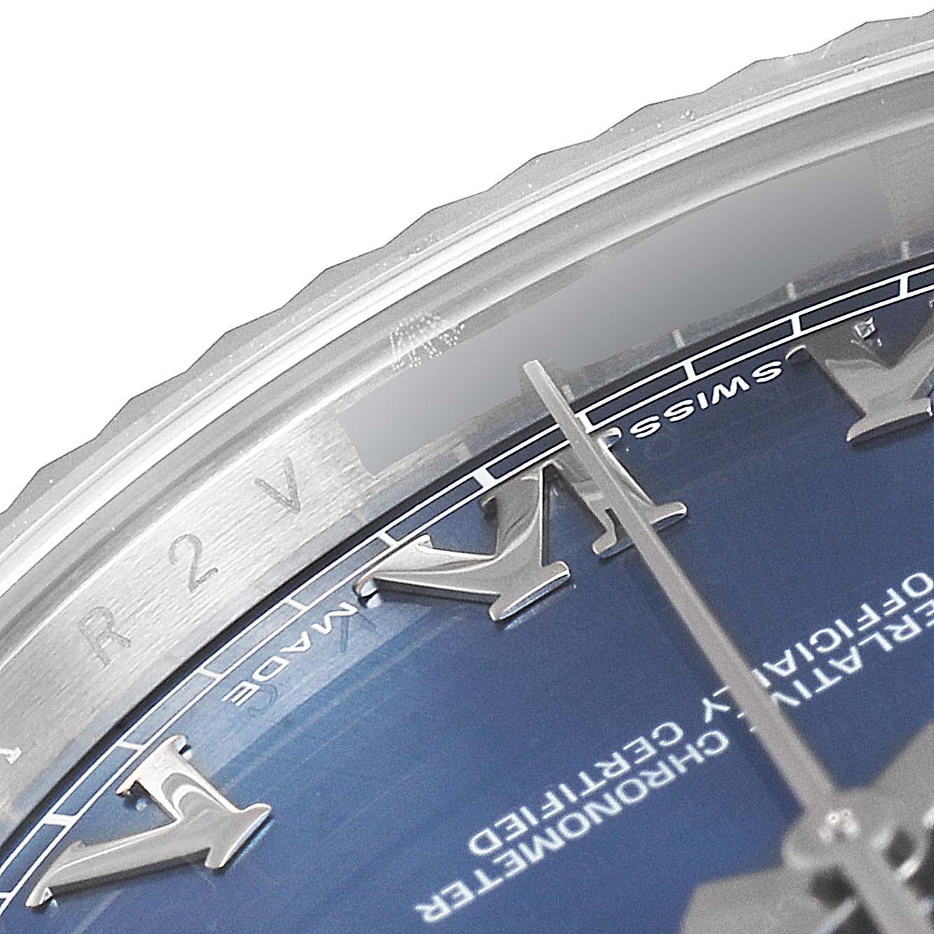 This image shows part of the watch face, bezel, and Roman numeral indices of a Rolex Datejust 41 116334 Men's Stainless Steel Blue Dial 116334 Men's Stainless Steel Blue Dial.