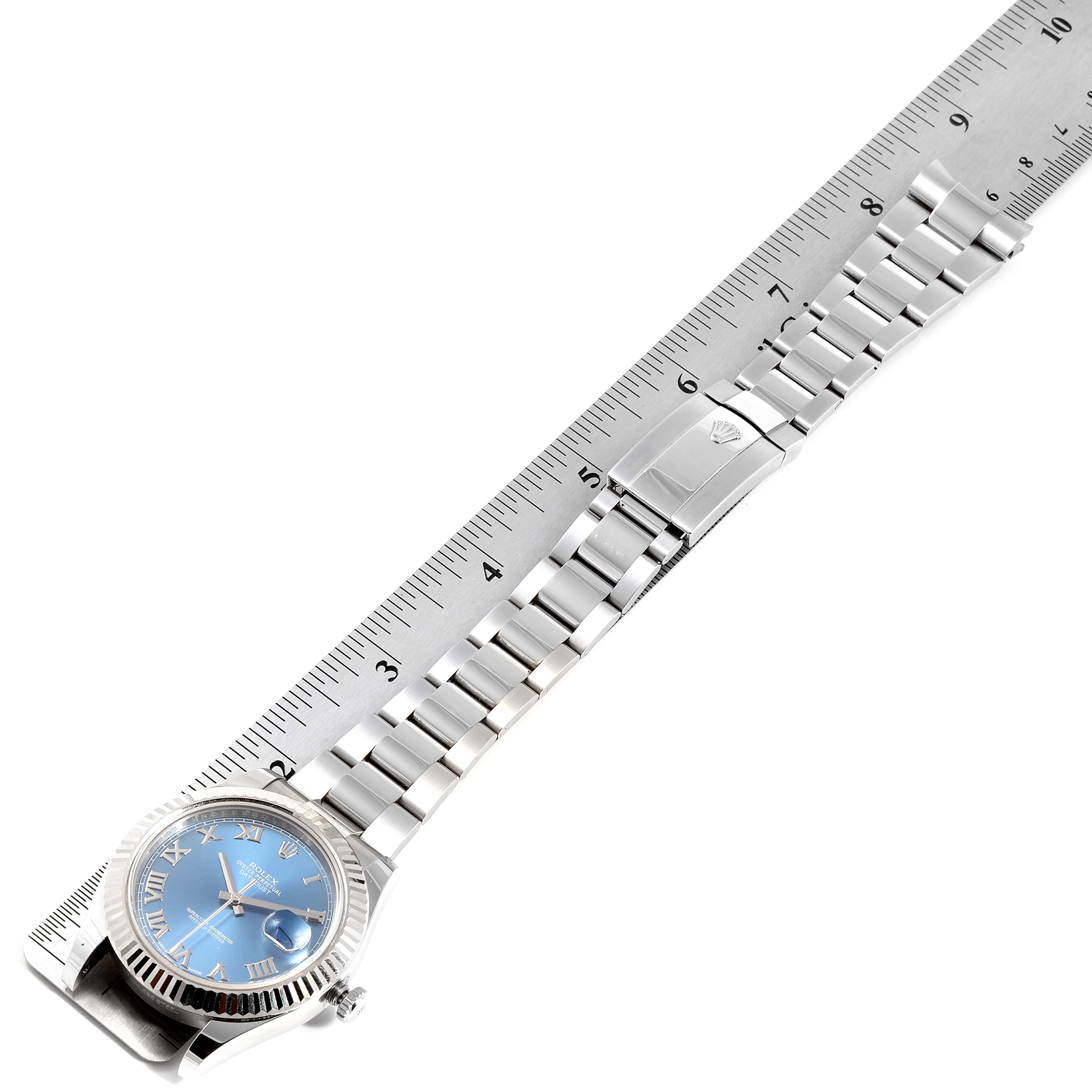 The image shows a Rolex Datejust 41 116334 Men's Stainless Steel Blue Dial 116334 Men's Stainless Steel Blue Dial watch with a blue dial and stainless steel bracelet, positioned alongside a ruler.