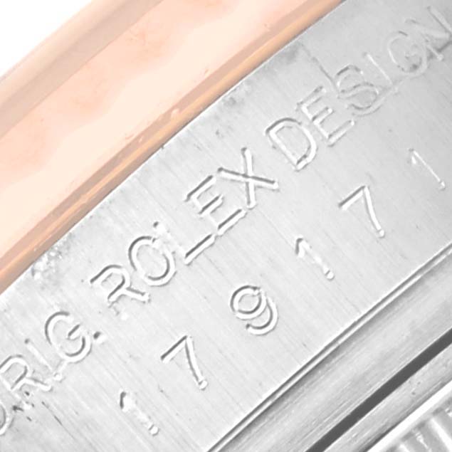This close-up image shows the engraving on the side of the case of a Rolex Datejust 179171 Women's Steel and Gold (two tone) Pink Dial 179171 Women's Steel and Gold (two tone) Pink Dial watch.