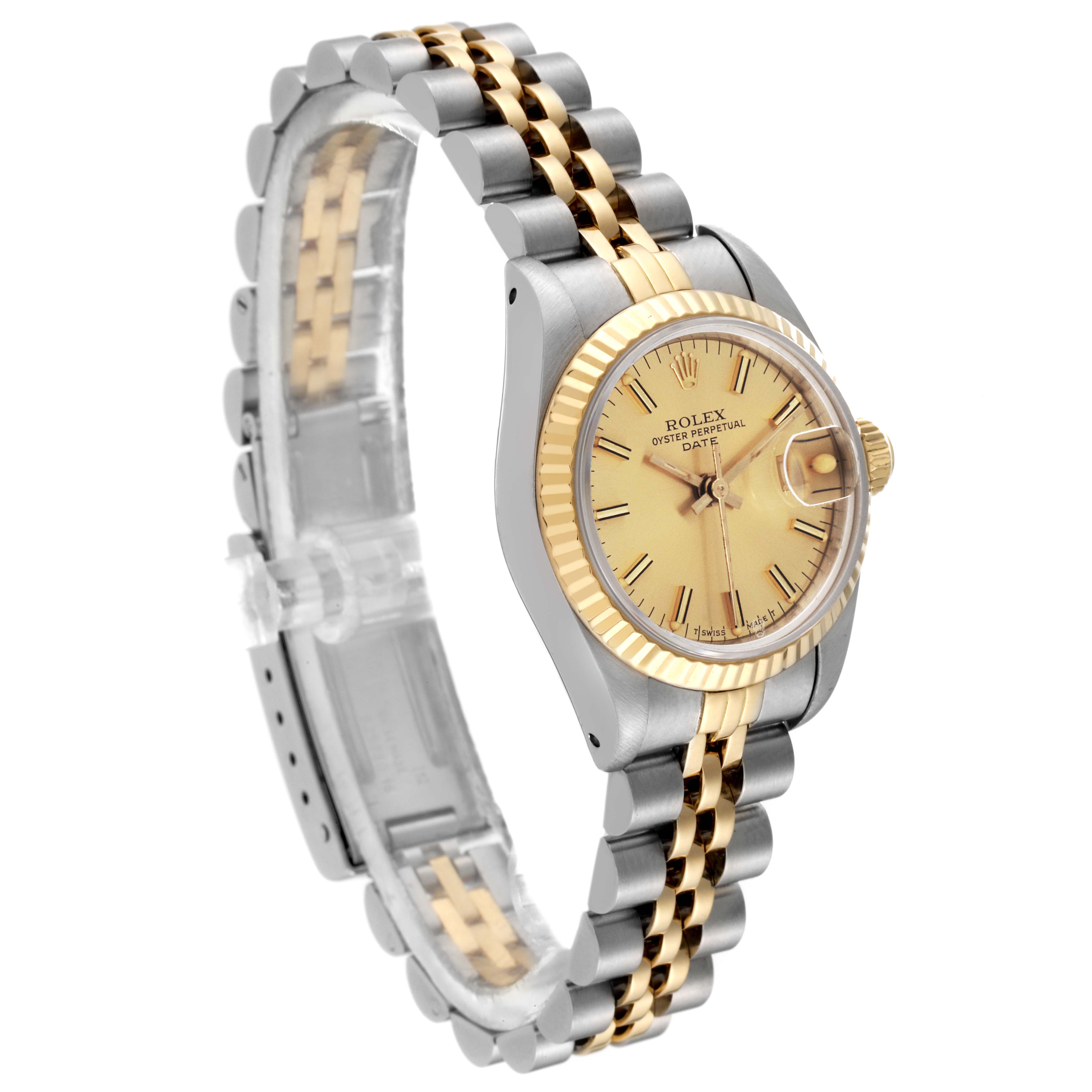 The image shows a Rolex Datejust 69173 Women's Steel and Gold (two tone) Champagne Dial 69173 Women's Steel and Gold (two tone) Champagne Dial watch from a front-side angle, highlighting its dial, fluted bezel, and two-tone bracelet.