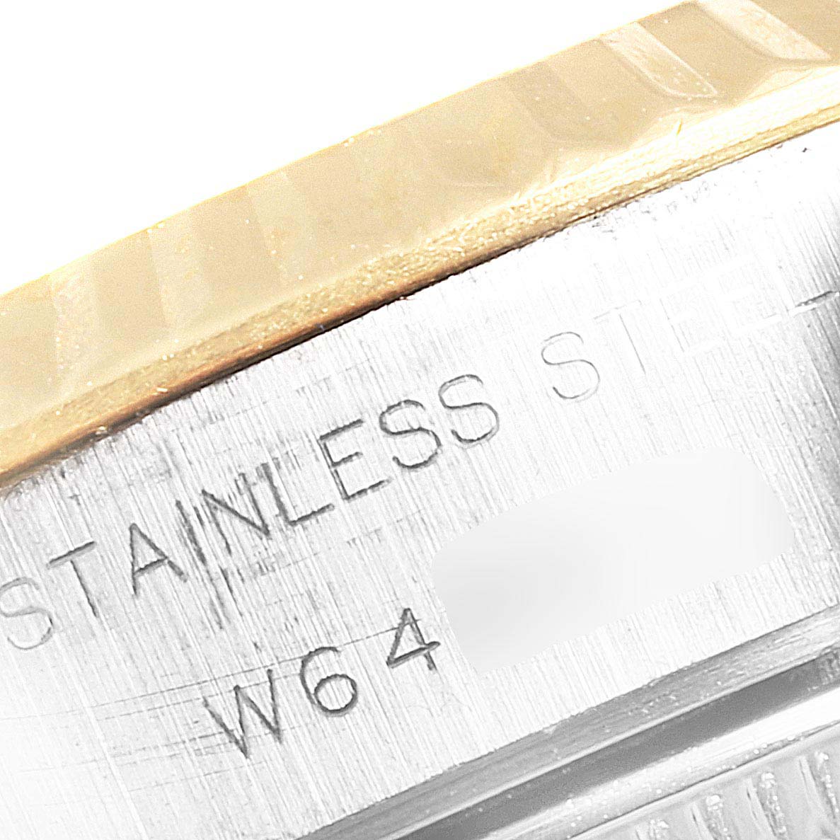 The image shows a close-up of the side of a Rolex Datejust 69173 Women's Steel and Gold (two tone) Champagne Dial 69173 Women's Steel and Gold (two tone) Champagne Dial watch, highlighting the stainless steel material.