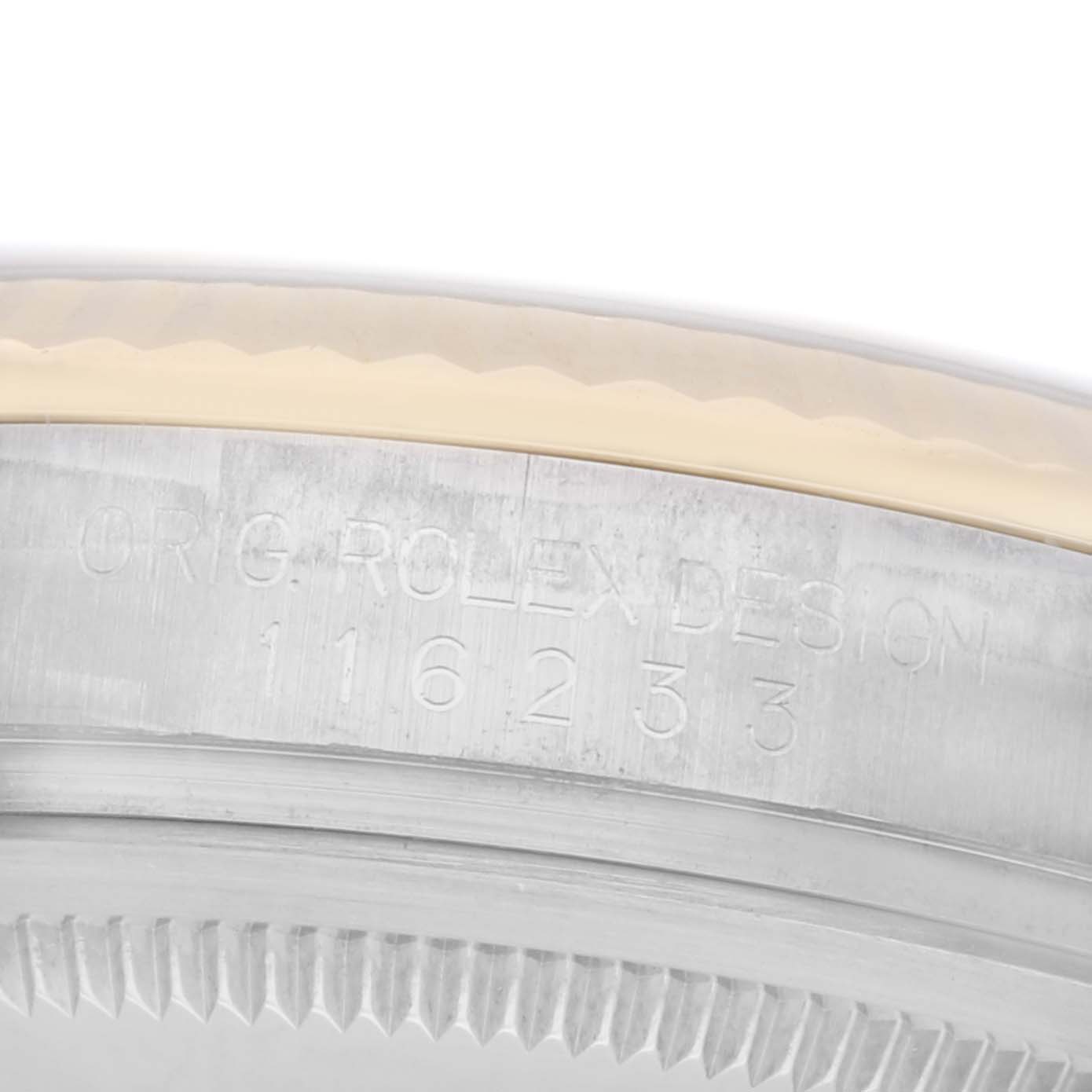 The image shows a close-up of the side of a Rolex Datejust model, model number 116233, focusing on the bezel and engravings.