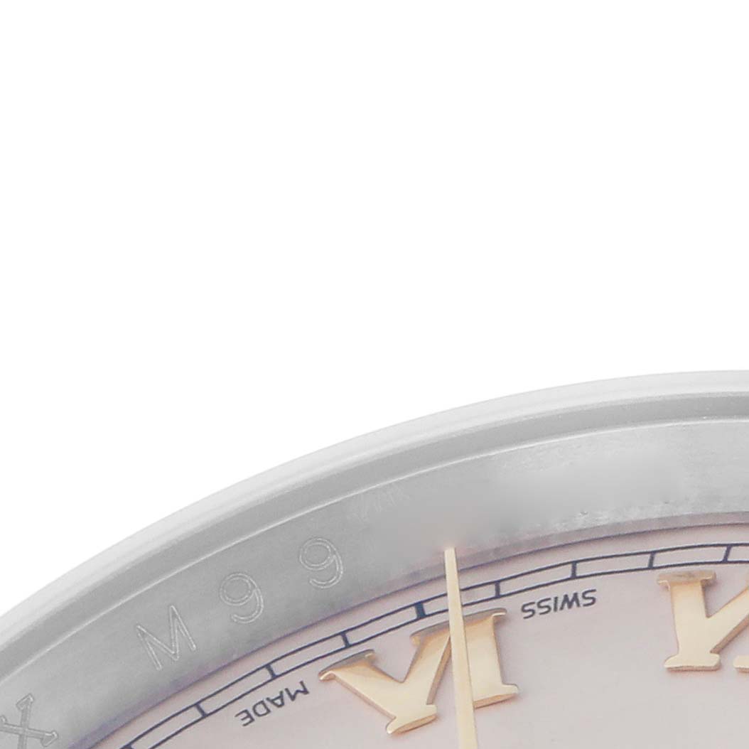 The image shows a close-up of the dial edge of a Rolex Datejust model 116233, highlighting the Roman numeral markers and part of the chapter ring.