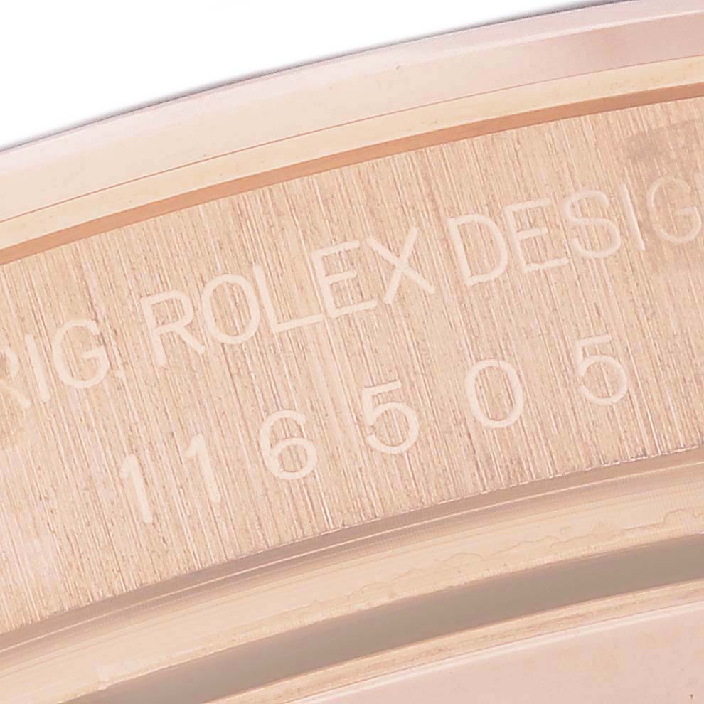 This close-up image shows the engraved serial number details on the case of a Rolex Daytona 116505 Men's Rose Gold Brown Dial 116505 Men's Rose Gold Brown Dial watch.
