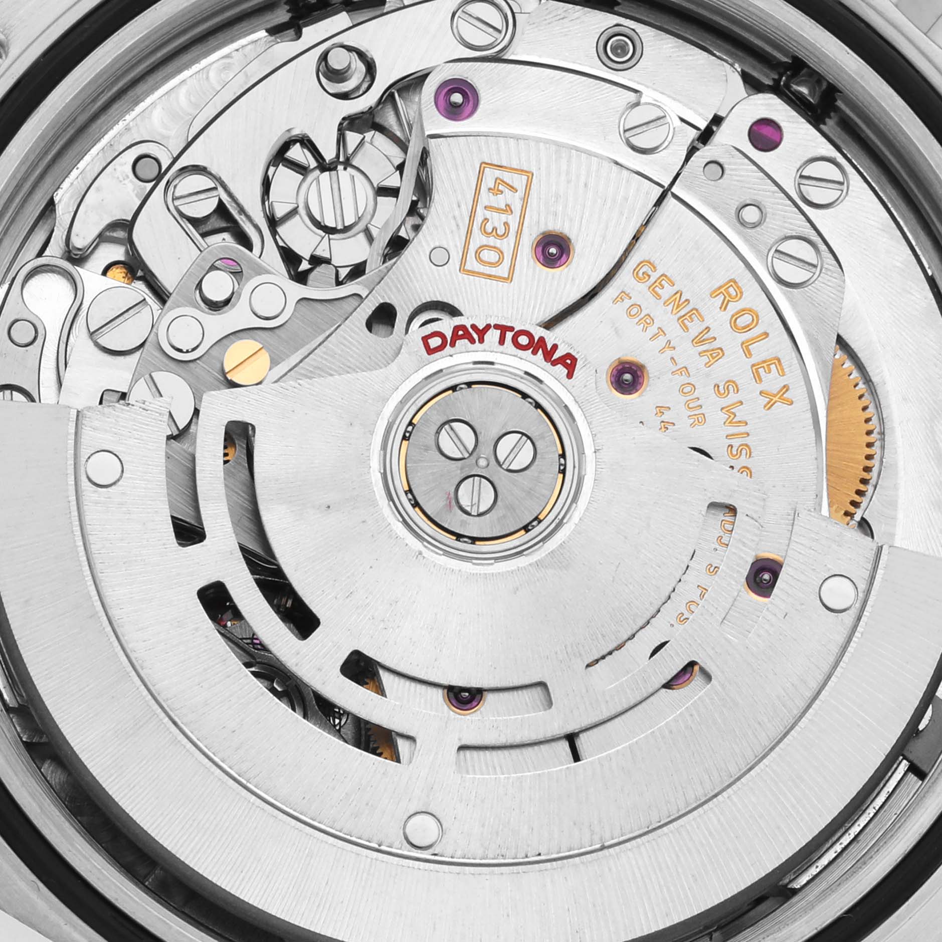 The image shows the intricate internal mechanism of a Rolex Daytona 116520 Men's Stainless Steel Black Dial 116520 Men's Stainless Steel Black Dial watch, highlighting the rotor, gears, and engravings.