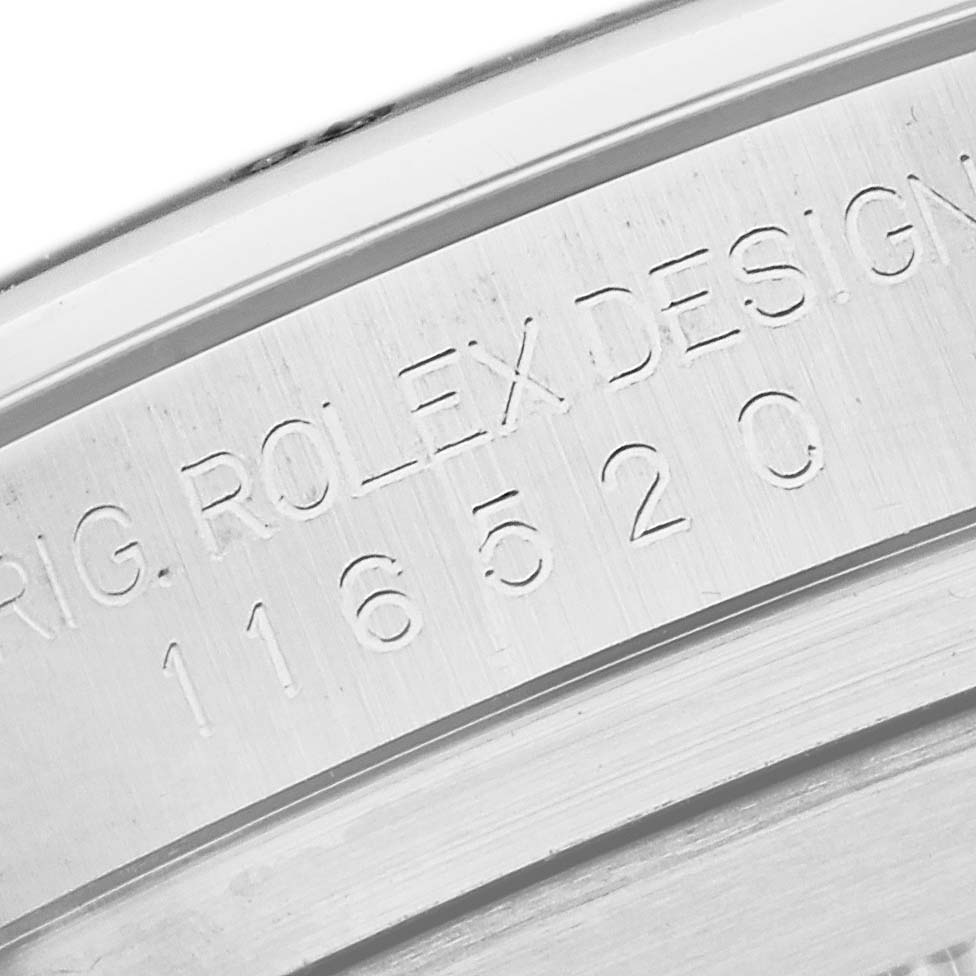 This image shows an angled close-up of the inner case back engraving of the Rolex Daytona 116520 Men's Stainless Steel Black Dial 116520 Men's Stainless Steel Black Dial model.