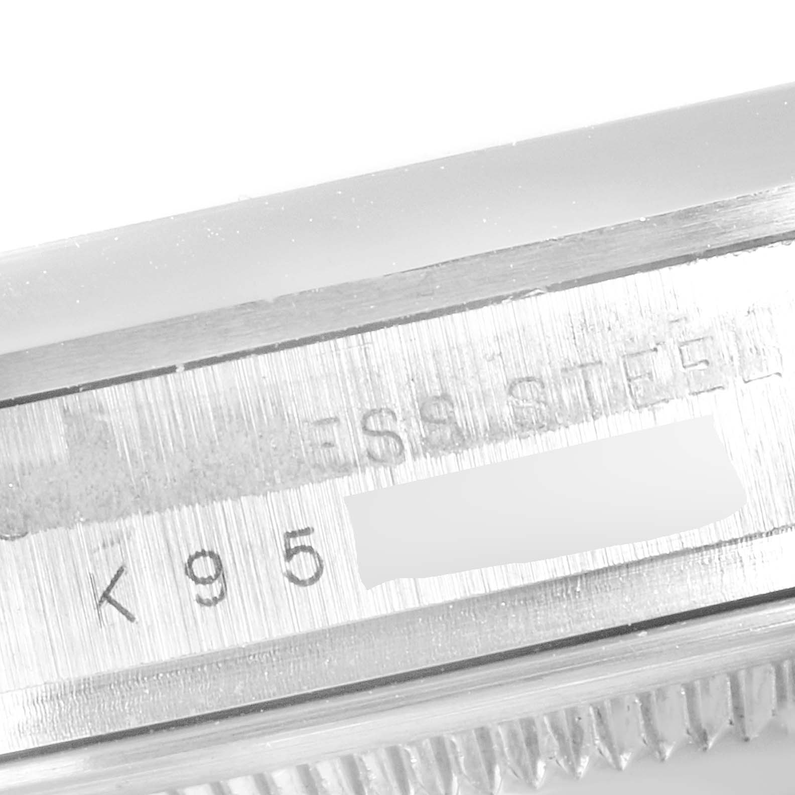 The image shows a close-up of the case with serial numbers on the side of the Rolex Explorer 114270 Men
s Stainless Steel Black Dial 114270 Men
s Stainless Steel Black Dial watch.