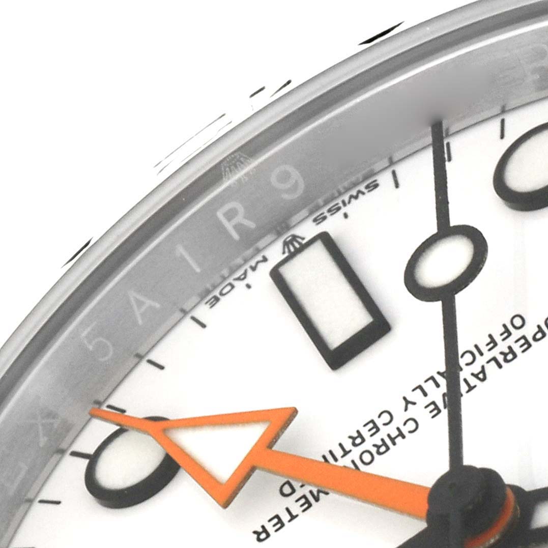 This image shows a close-up angle of the dial, hands, and part of the bezel of a Rolex Explorer 226570 Men's Stainless Steel White Dial 226570 Men's Stainless Steel White Dial watch.